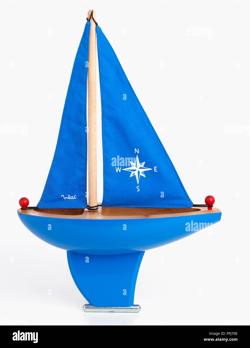 Children's blue plastic sailing boat Stock Photo