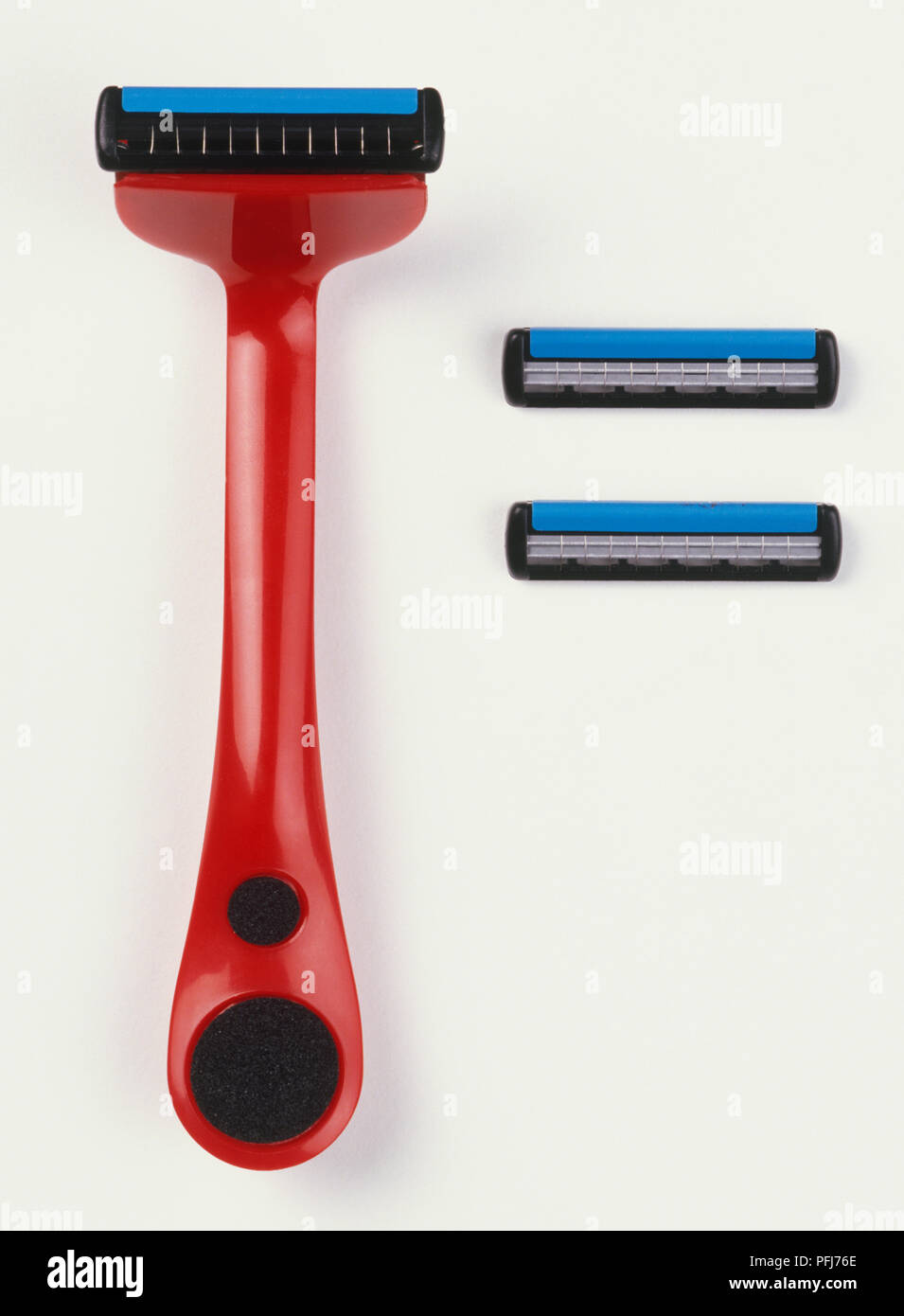Disposable razor and two blades, close up. Stock Photo