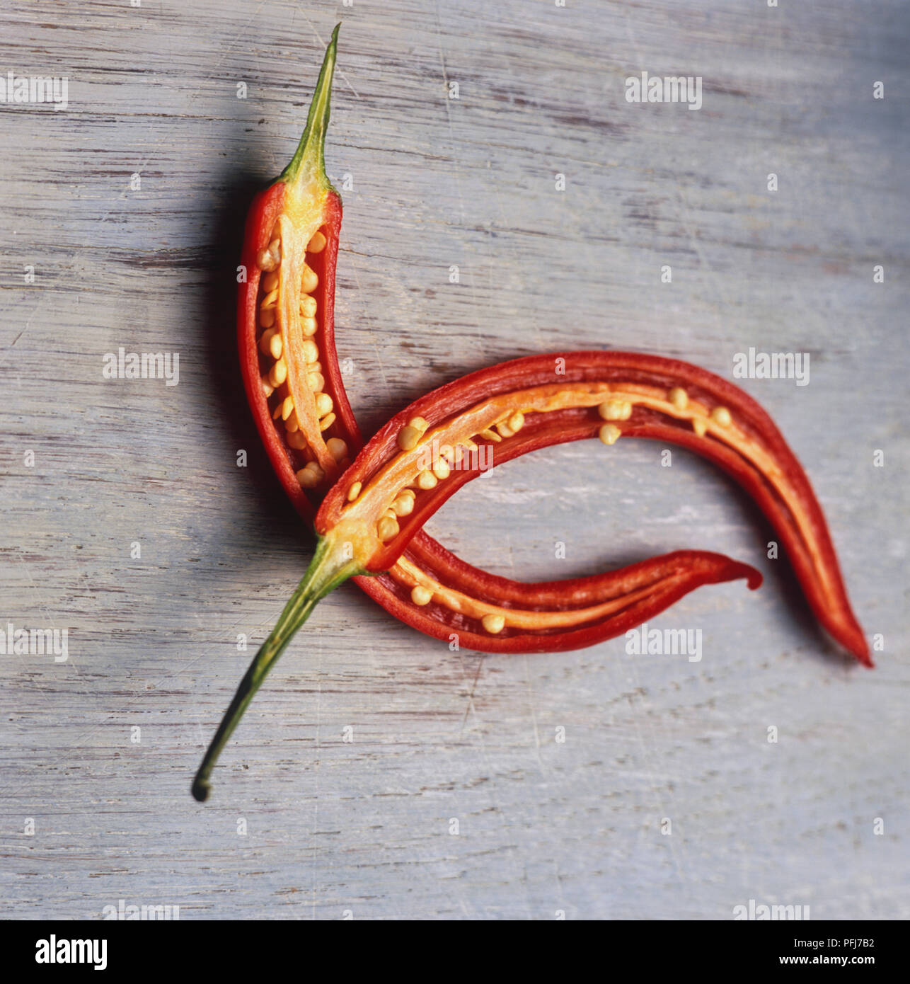 Capsicum annuum longum, Red Chilli, cut in half, showing seeds inside