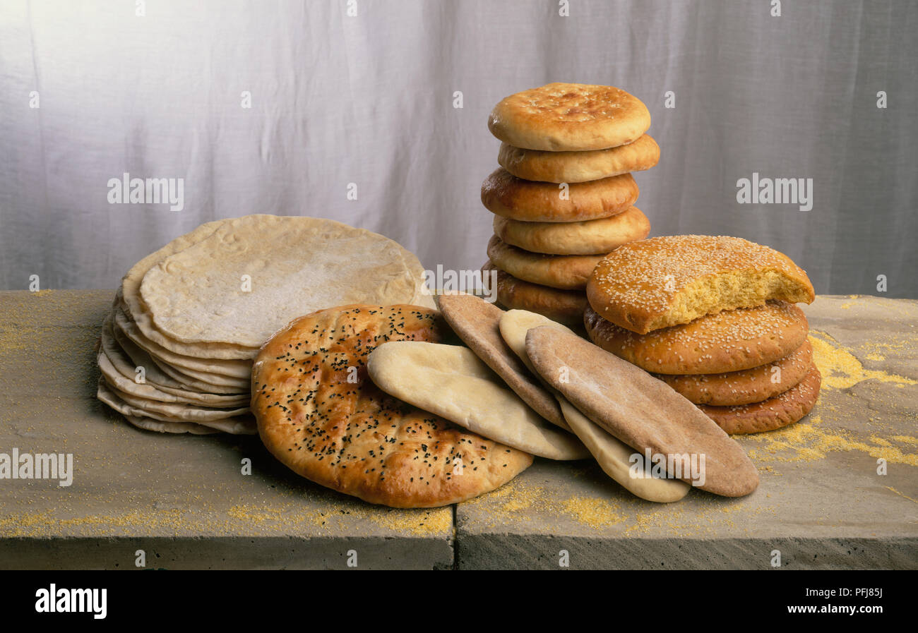Stacks of North African and Middle Eastern flat breads, including Lavash, Pide, Pitta, Pain Tunisien and Barbari Stock Photo