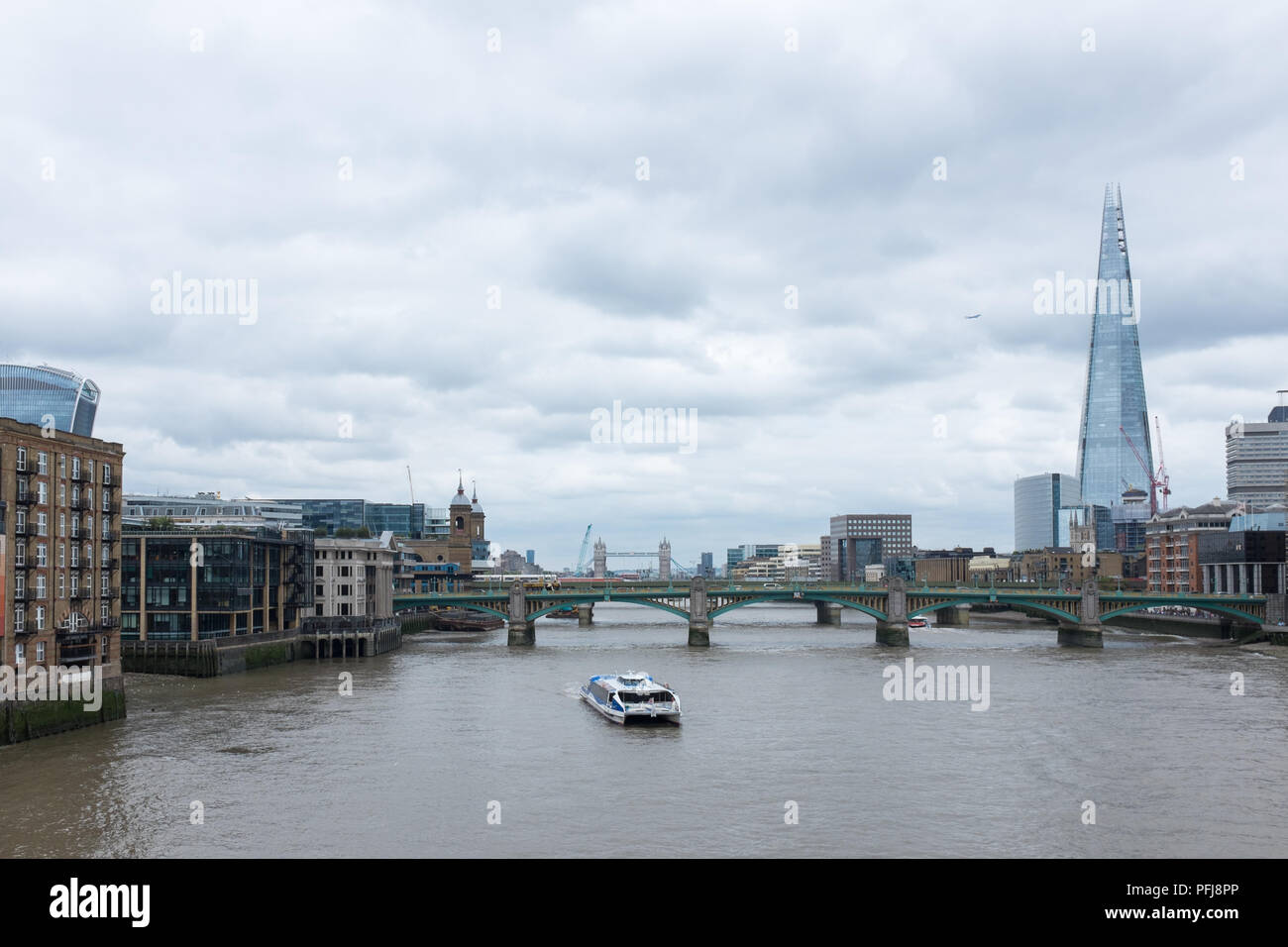 View along River Thames from Millennium Bridge looking East towards The Shard building Stock Photo