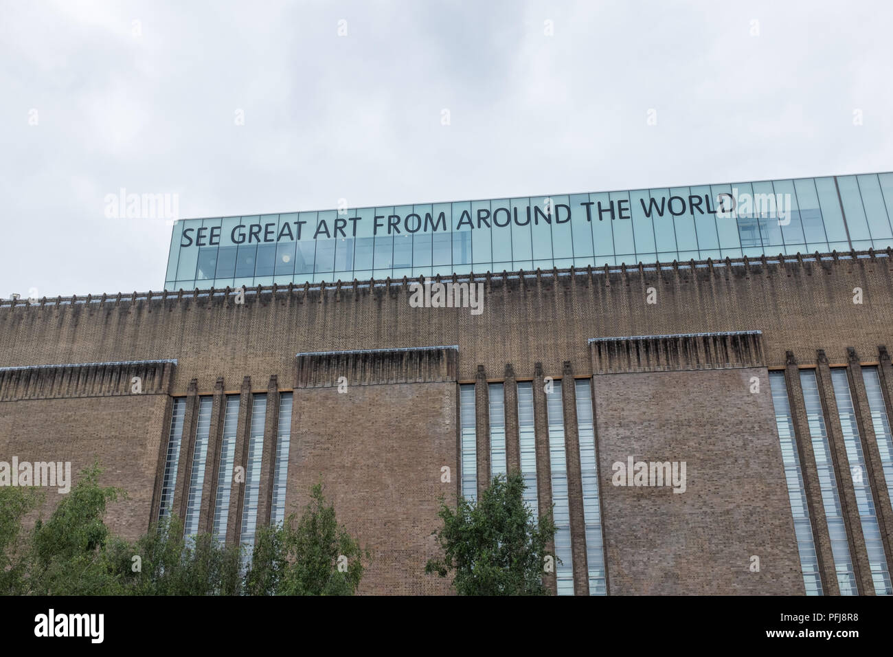 Sign on roof of Tate Modern in London saying 'see great art from around the world' Stock Photo