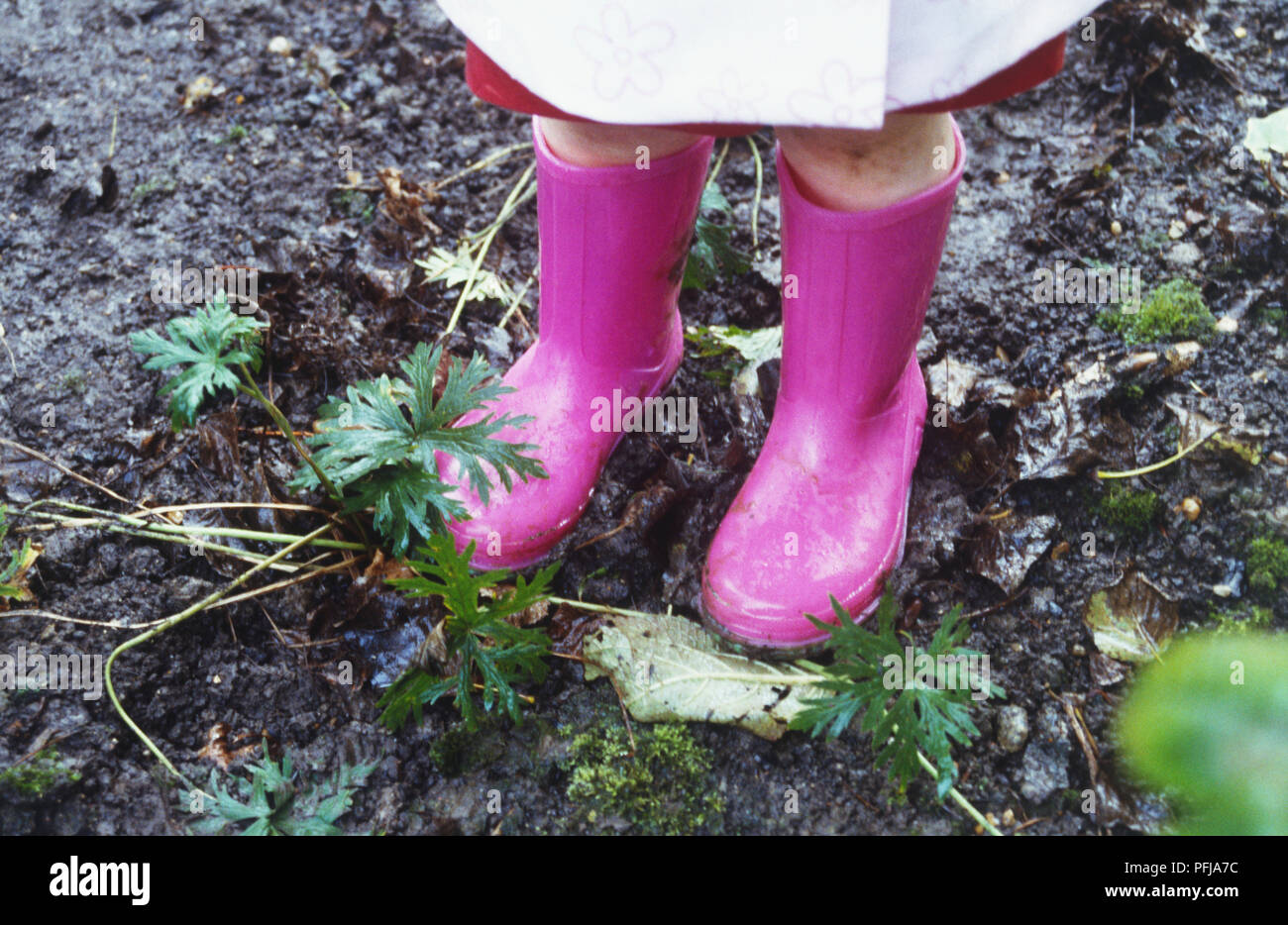 Two children in wellington boots hi-res stock photography and images ...
