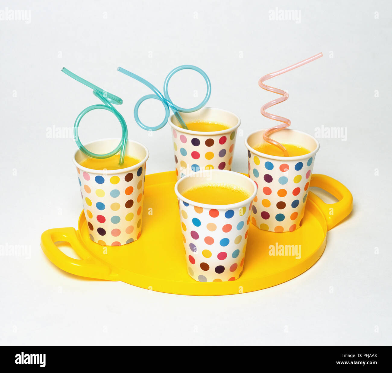 Download Four Multi Coloured Spotted Paper Cups Containing Orange Juice And Straws On Yellow Tray Stock Photo Alamy PSD Mockup Templates