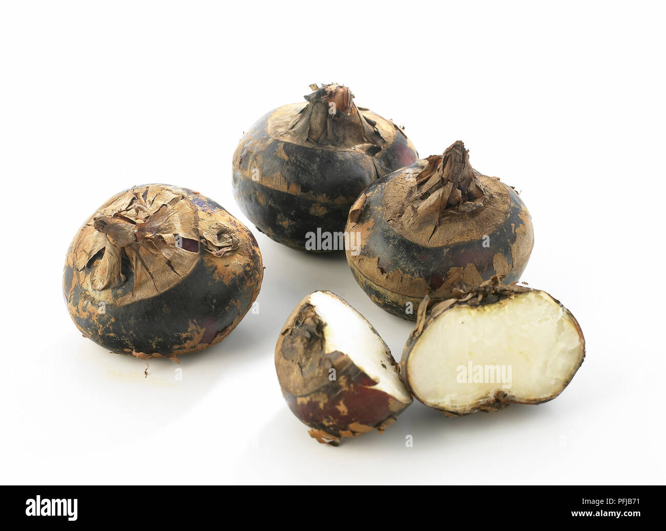Water chestnuts, whole and halved Stock Photo Alamy