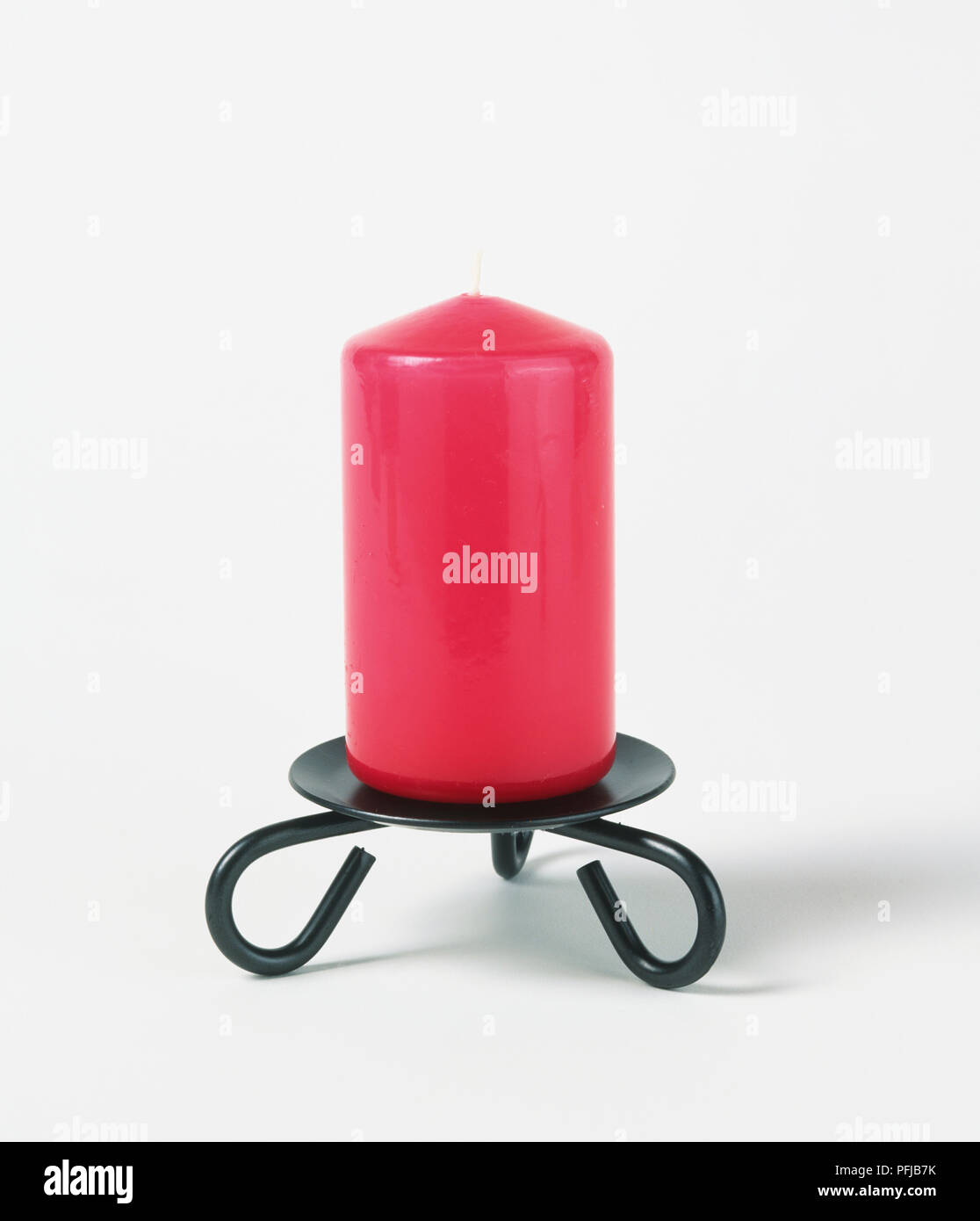 Red candle on candlestick Stock Photo Alamy