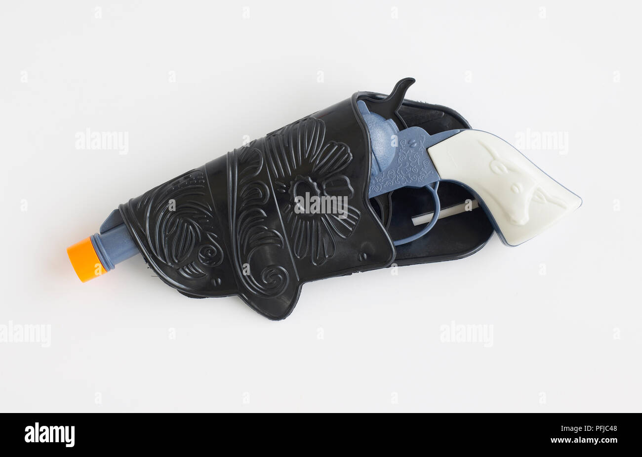 Plastic blue toy revolver in holster, side view Stock Photo Alamy