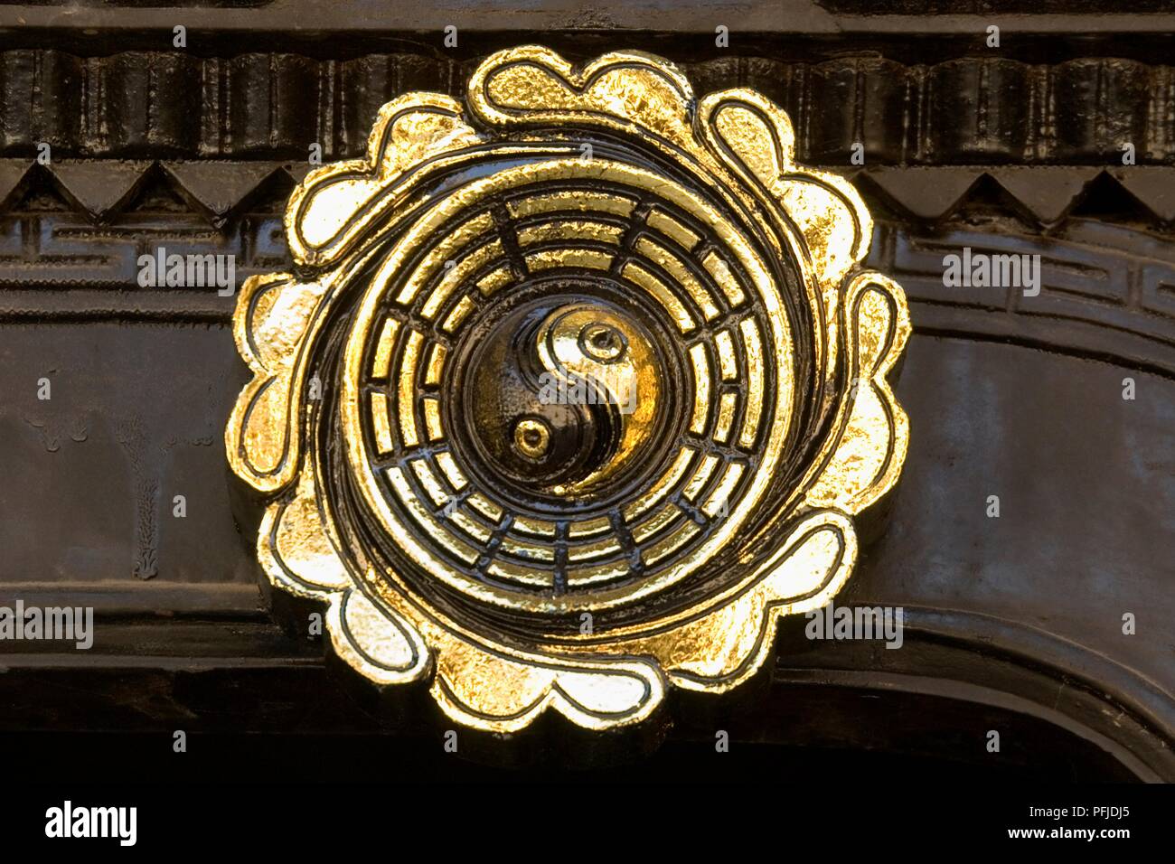 Vietnam, Quang Nam, Hoi An, gold and brown yinyang symbol in circular