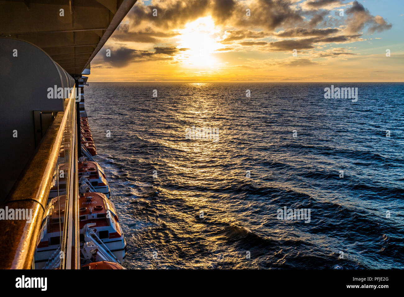 A sunset over the NW Pacific coast near Prince of Wales Island, Alaska, USA - Viewed from a cruise ship sailing the Inside Passage Stock Photo