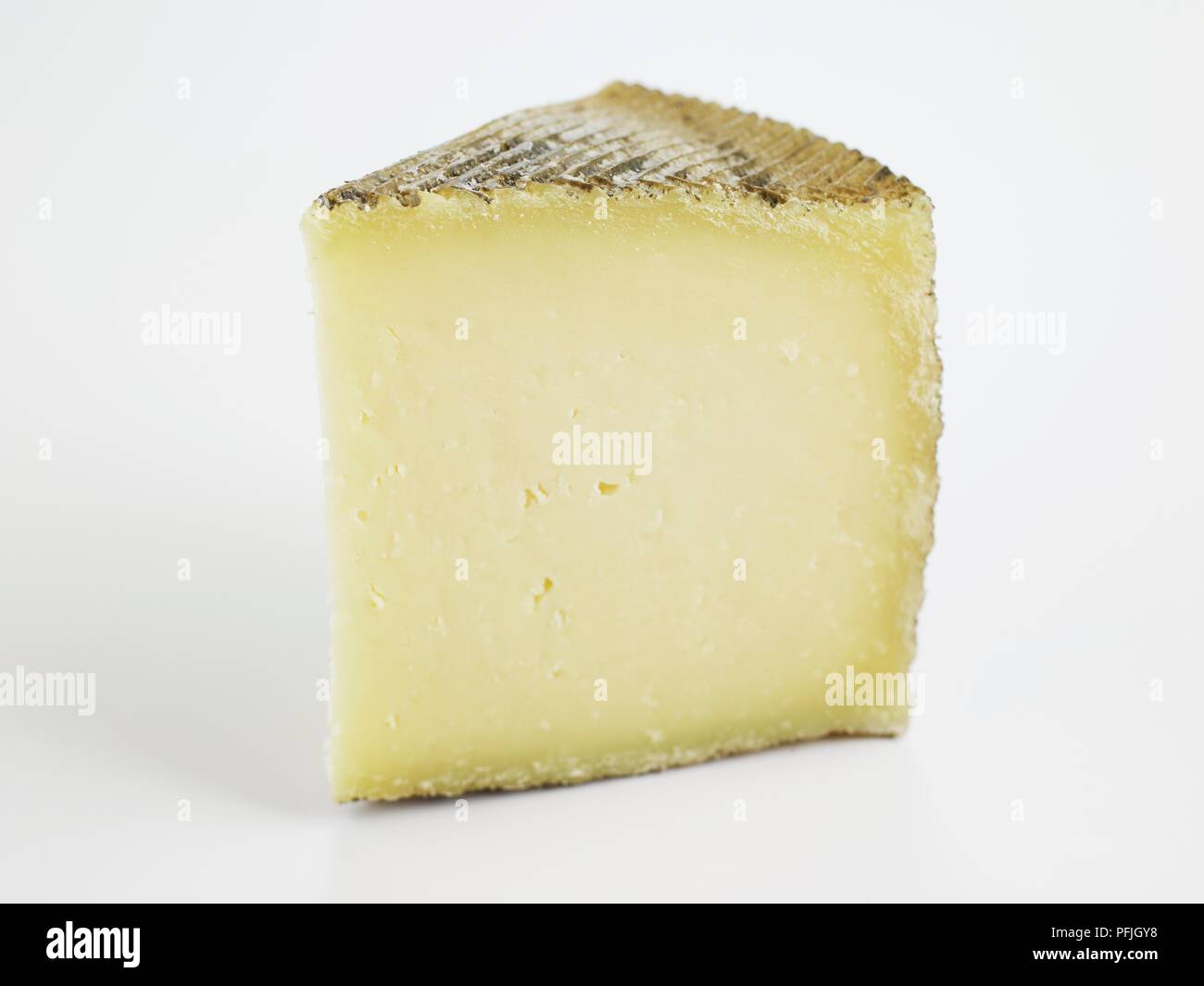 Slice of Spanish Castellano ewe's milk cheese Stock Photo Alamy