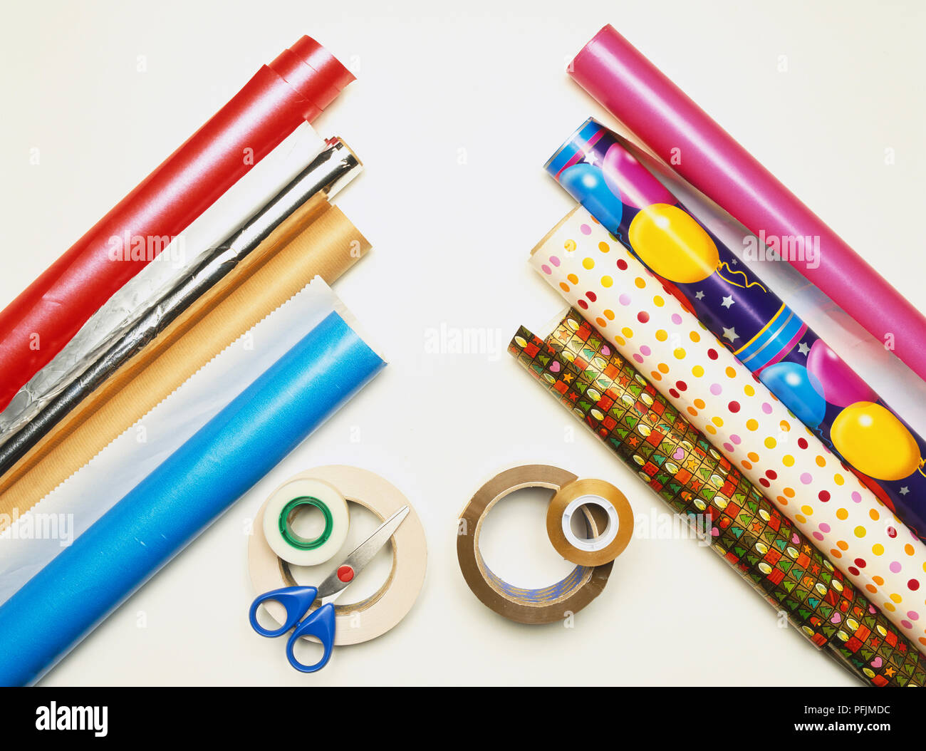 Different Colorful Wrapping Paper Rolls Scissors Threads White Wooden Table  Stock Photo by ©NewAfrica 594478194