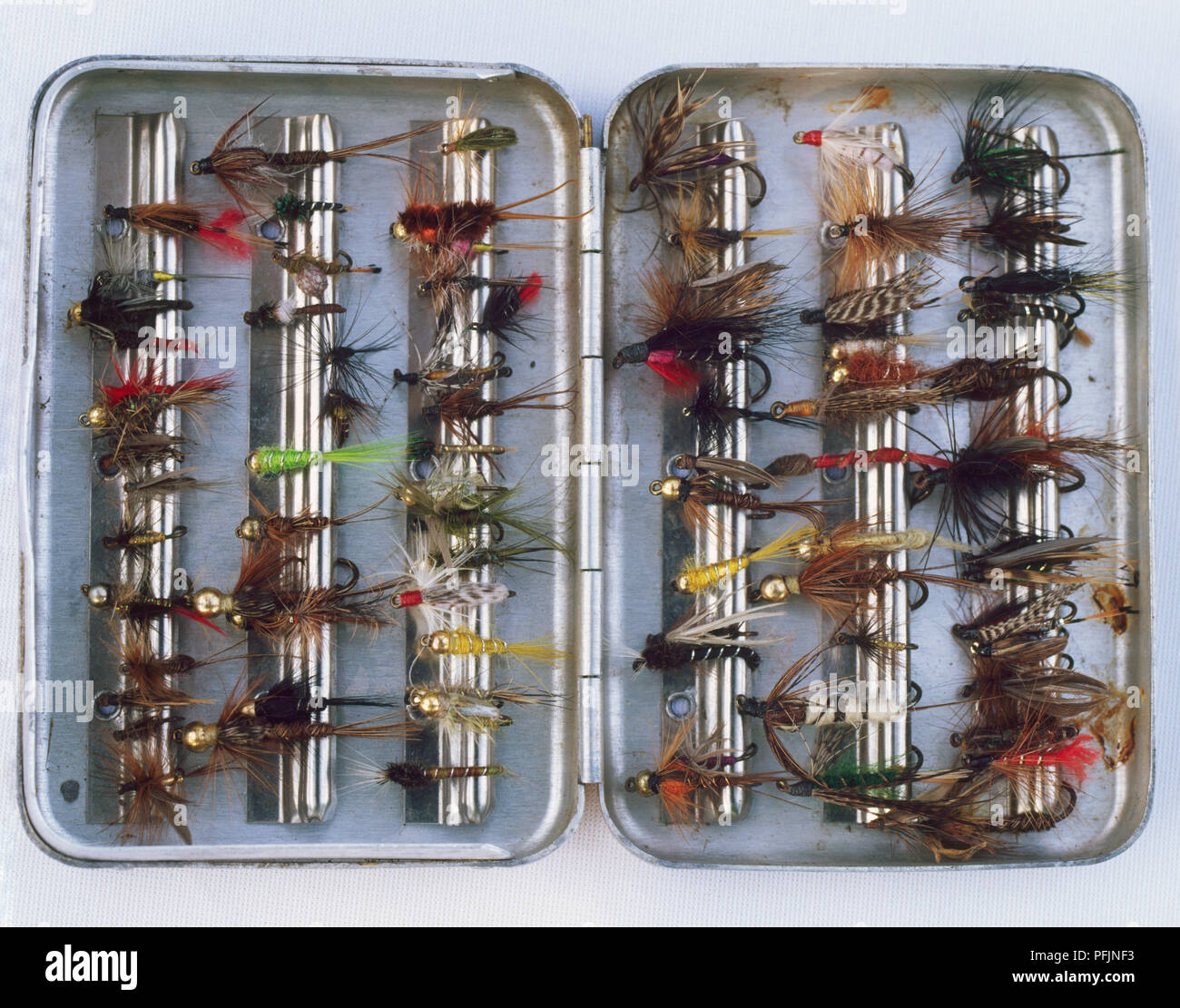 Fly fishing, selection of wet flies contained in metal box Stock
