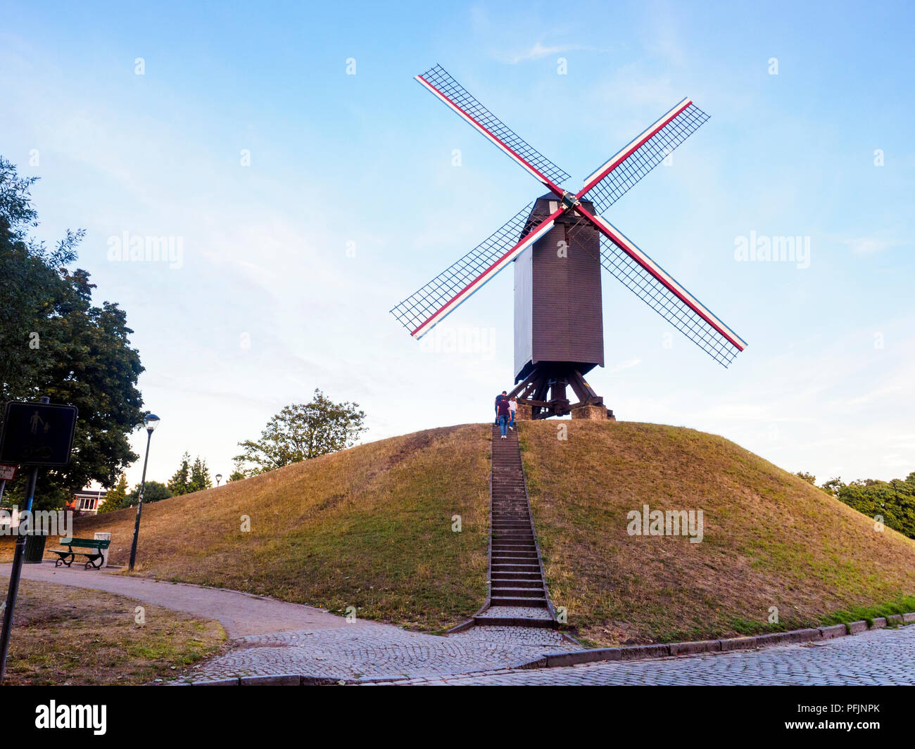 Sint-Janshuismolen windmill grinding grain in its original location since 1770 - Bruges, Belgium Stock Photo