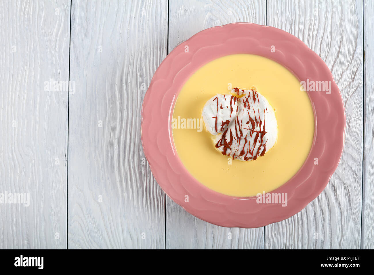 a floating island dessert or birds milk, consisting of meringue