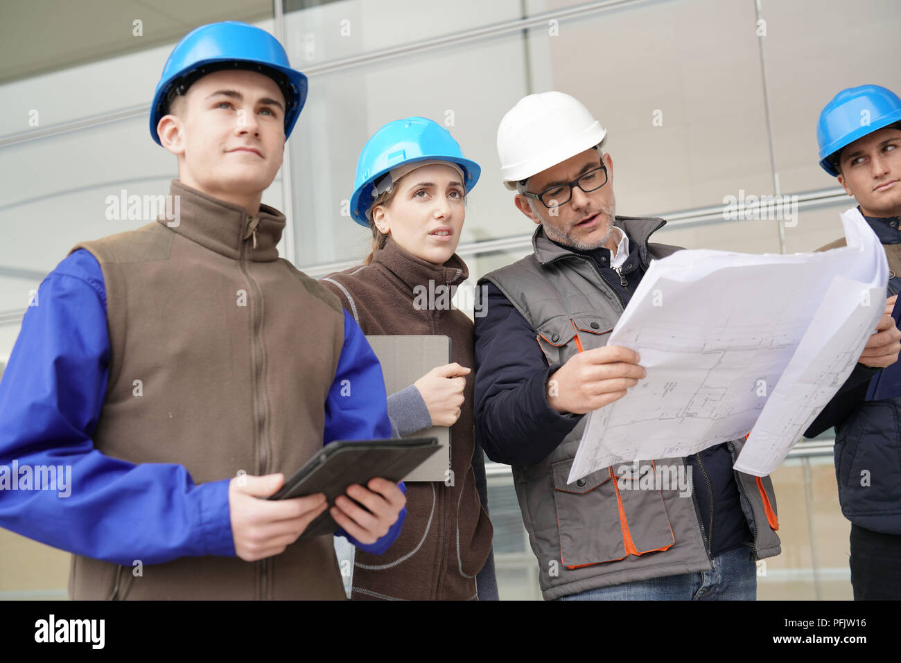 Instructor with young people in engineering training Stock Photo