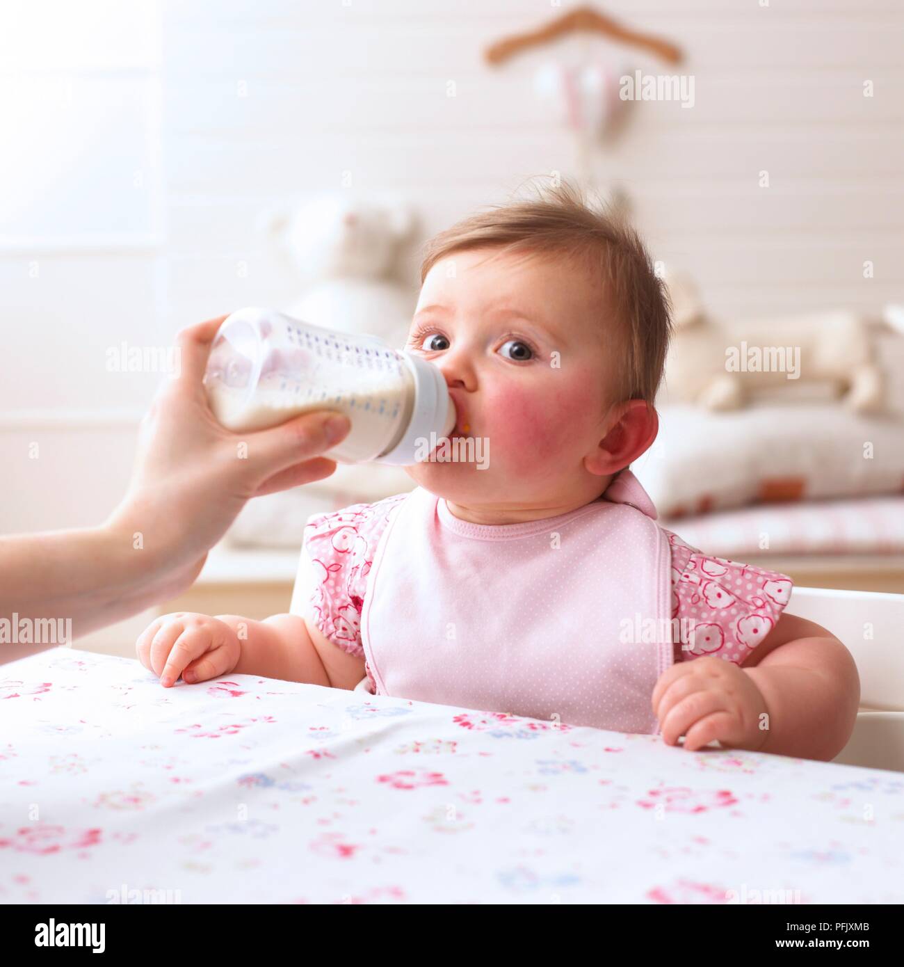 Baby holding bottle 11 hires stock photography and images Alamy