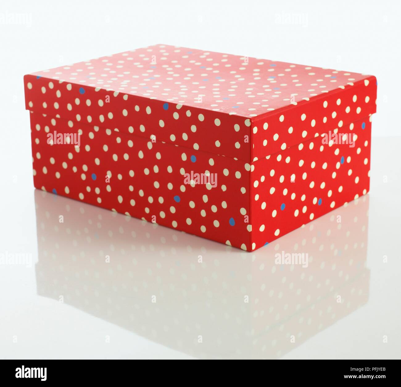Red, spotted box with lid on Stock Photo