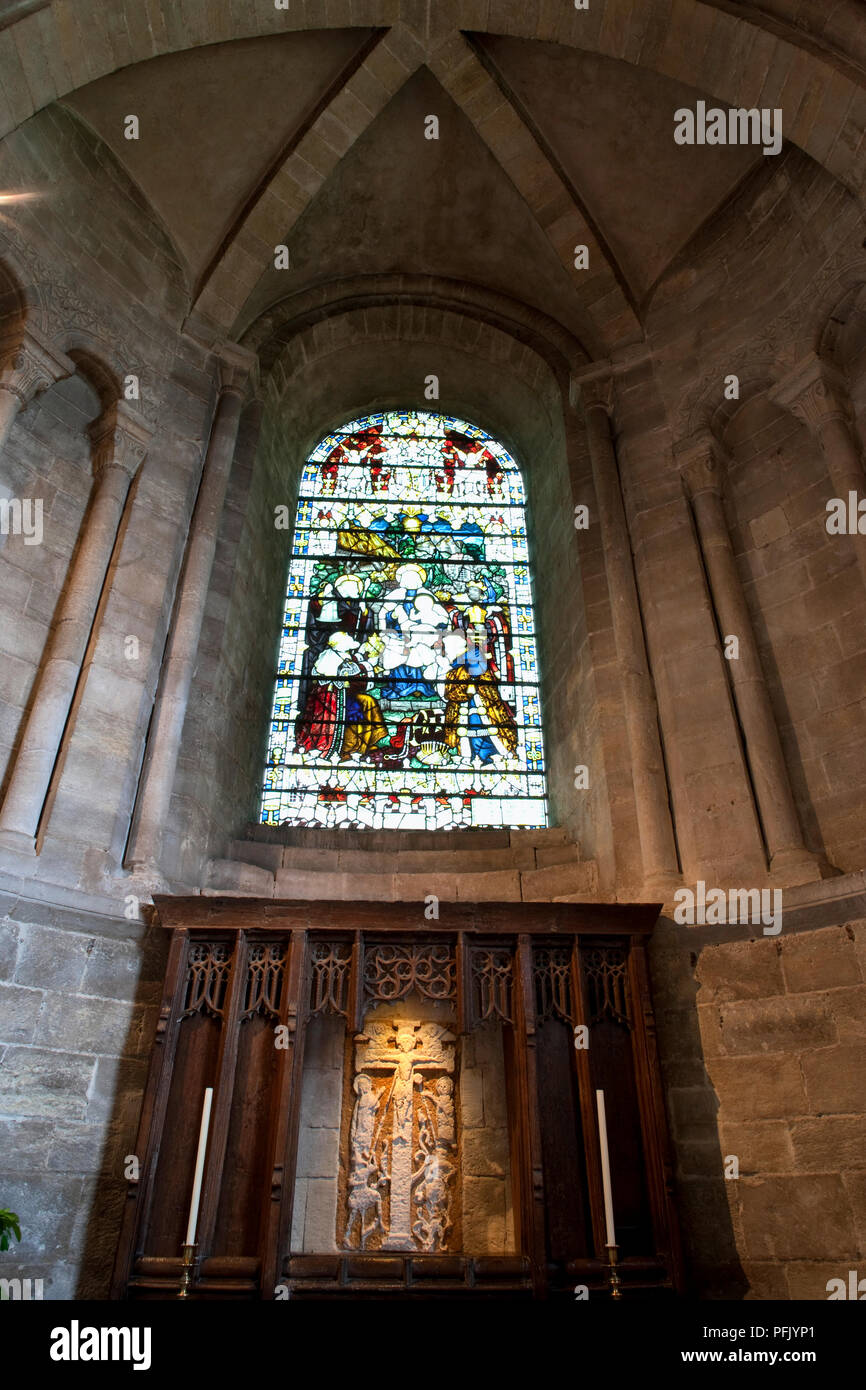 Great Britain, England, Hampshire, Romsey, Romsey Abbey, St Anne's Chapel, altar with Saxon crucifix dating from 10th century, underneath stained glass window Stock Photo