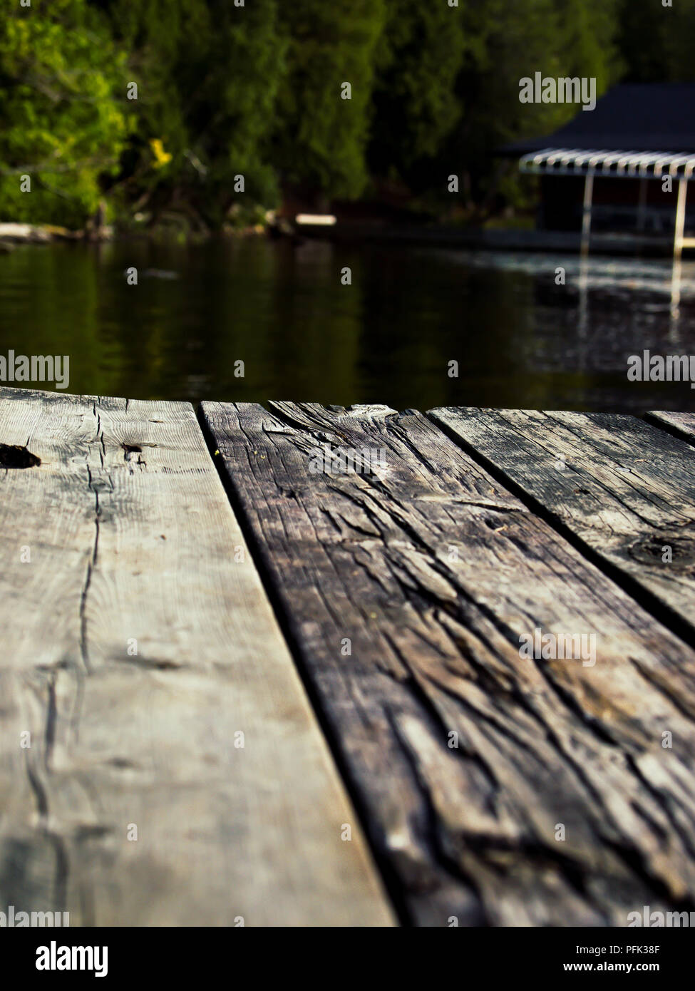 Wooden Dock on Muskoka Lake in Huntsville Stock Photo