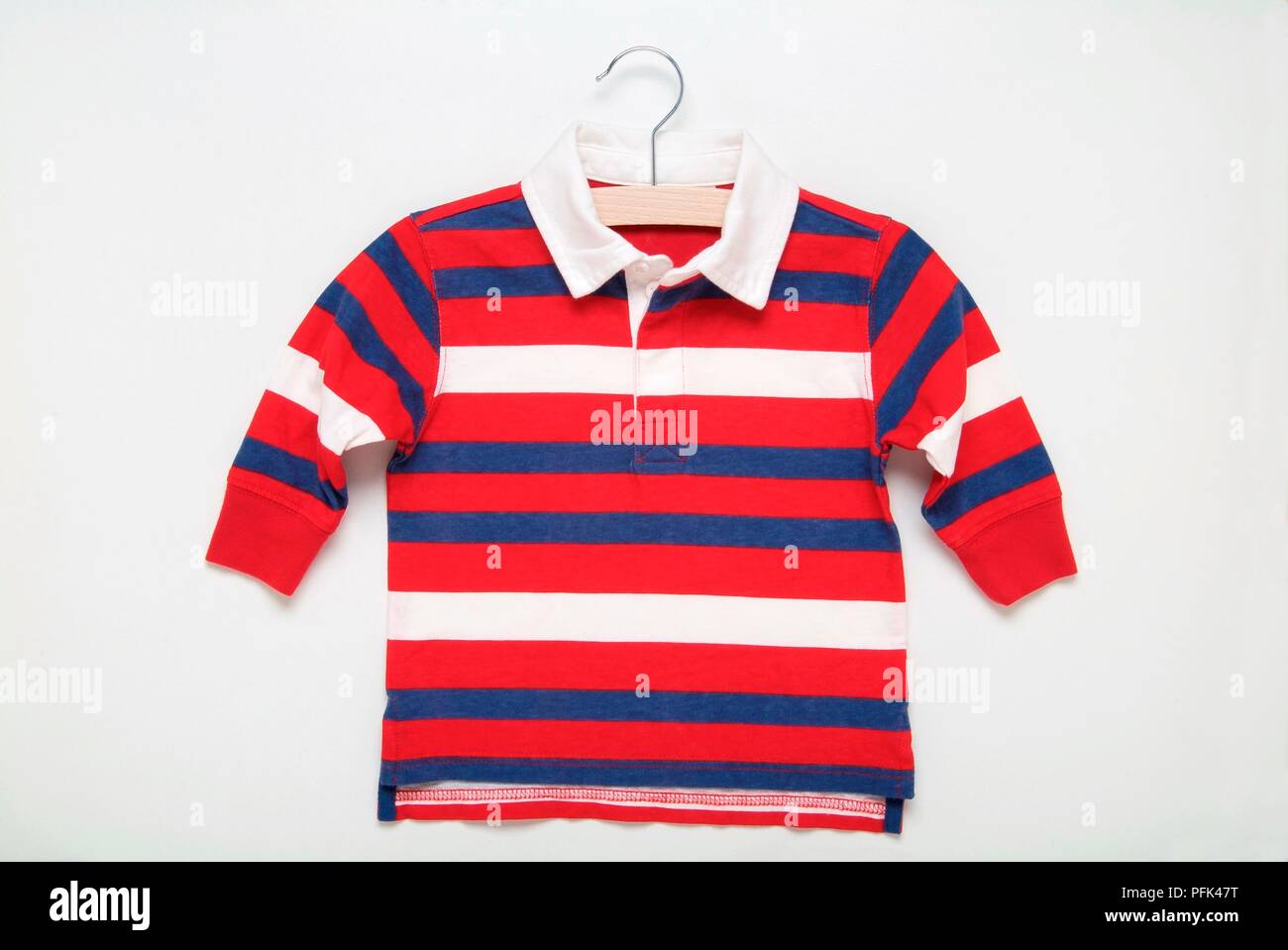 Red, white and blue striped jumper on coat hanger Stock Photo