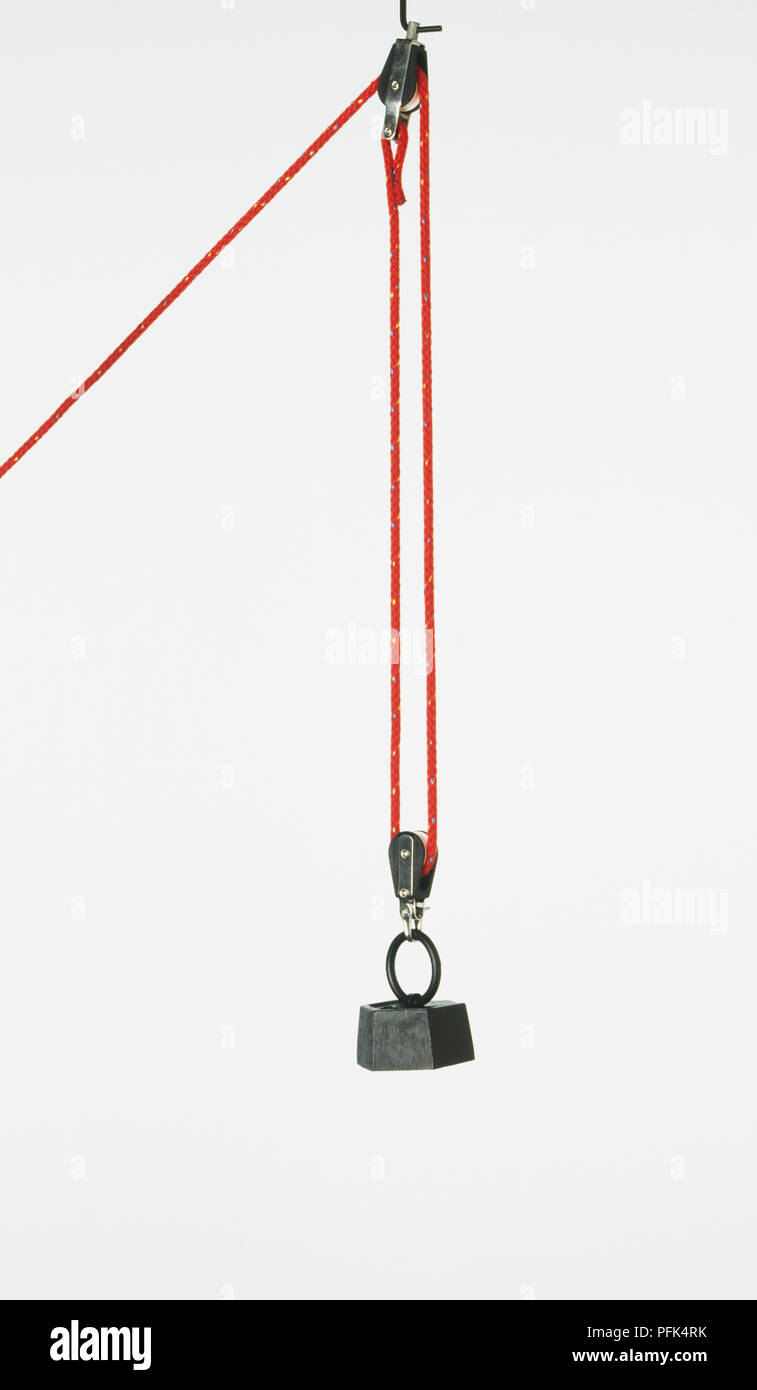 Weight on pulley Stock Photo