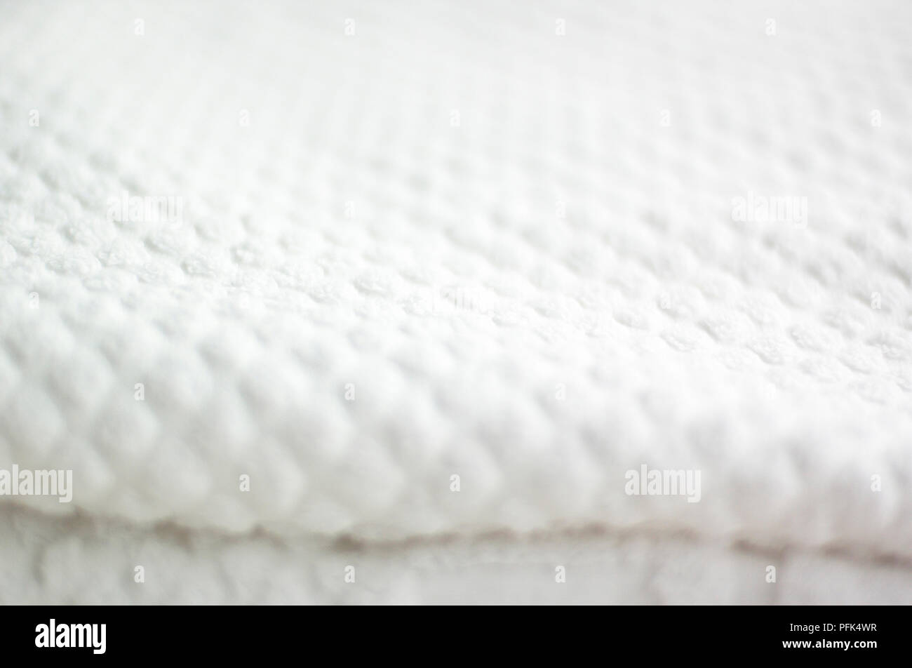 White textured baby blanket, folded up Stock Photo