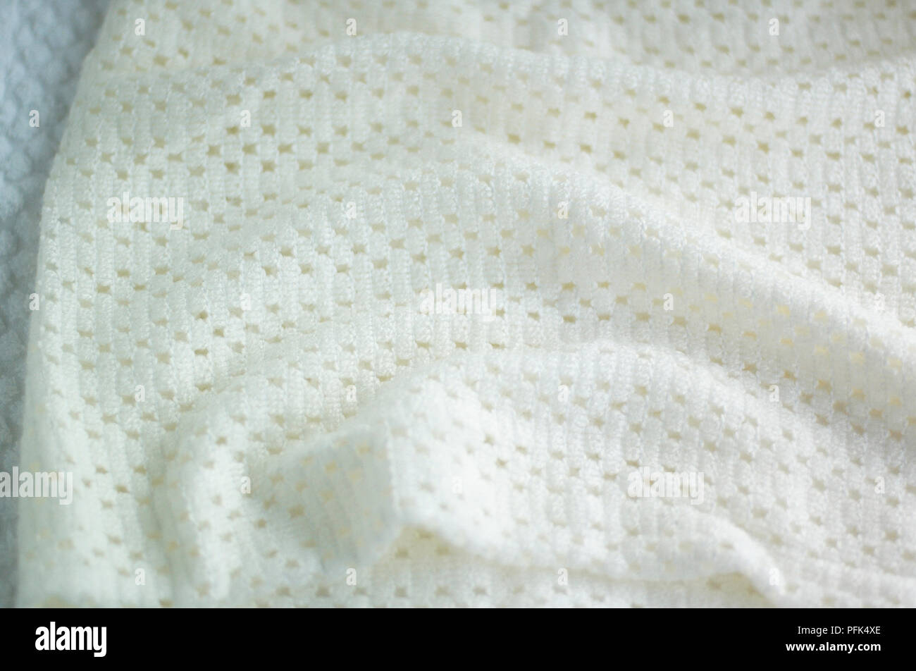 White crocheted baby blanket, close-up Stock Photo
