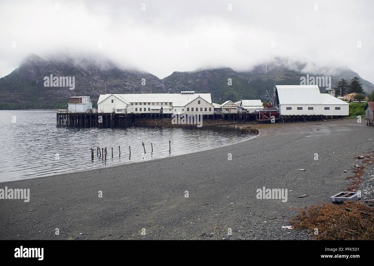 USA, Alaska, Annette Island, Metlakatla, clouds over cannery buildings in bay Stock Photo