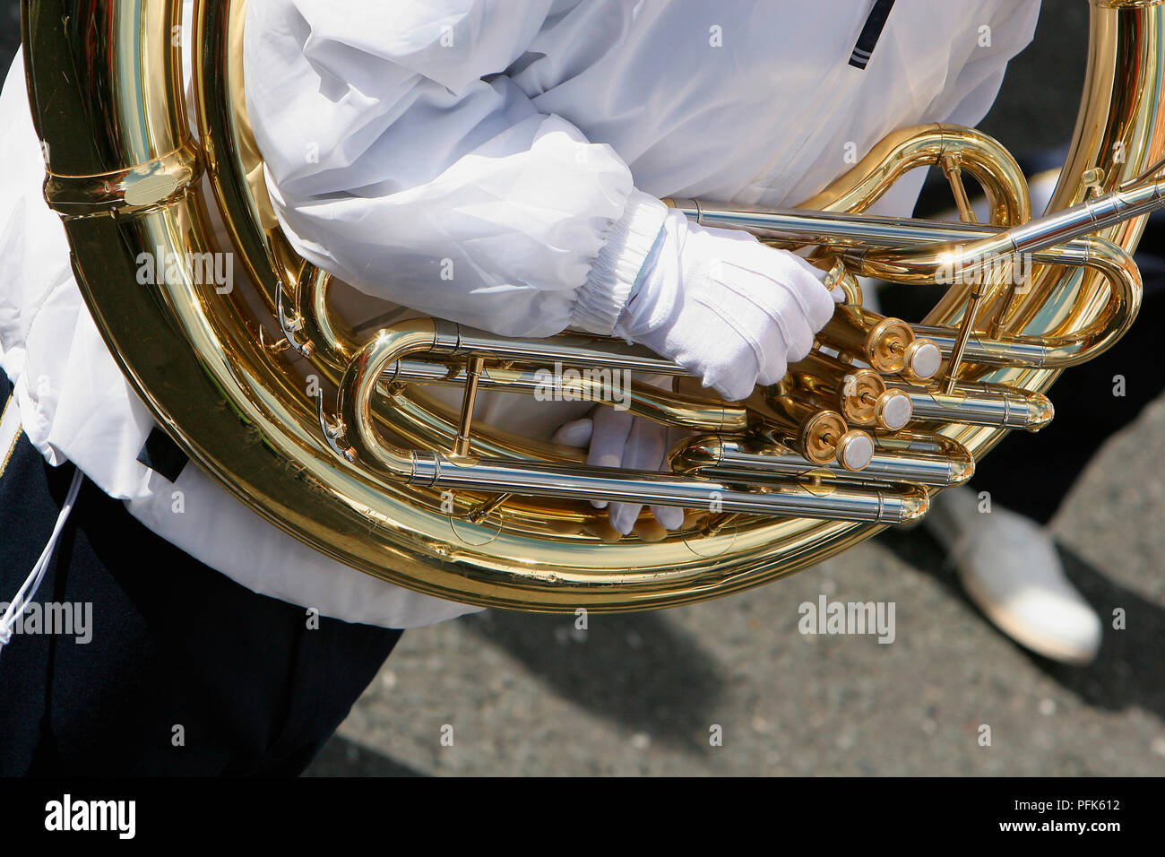 Ireland, Dublin, St Patrick's Day celebrations, musician with sousaphone round the shoulders, close-up Stock Photo