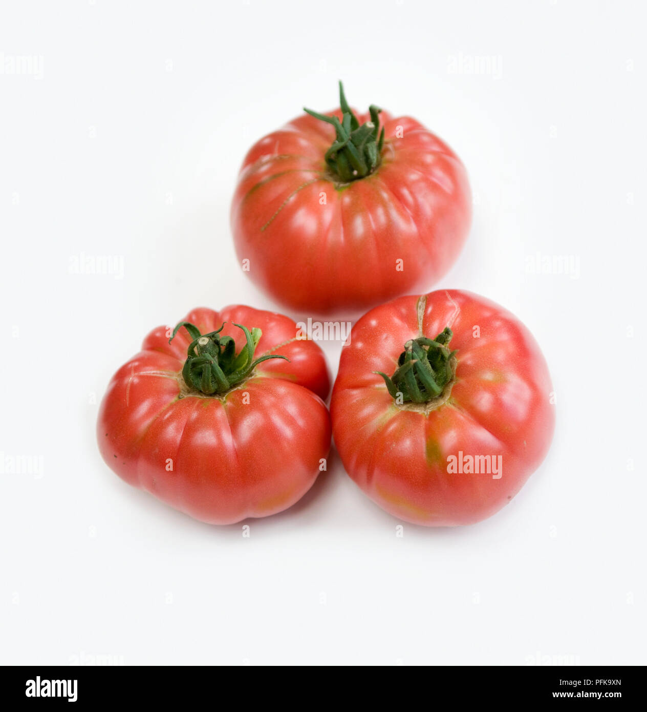Three brandywine tomatoes, heirloom beefsteak tomato, closeup Stock