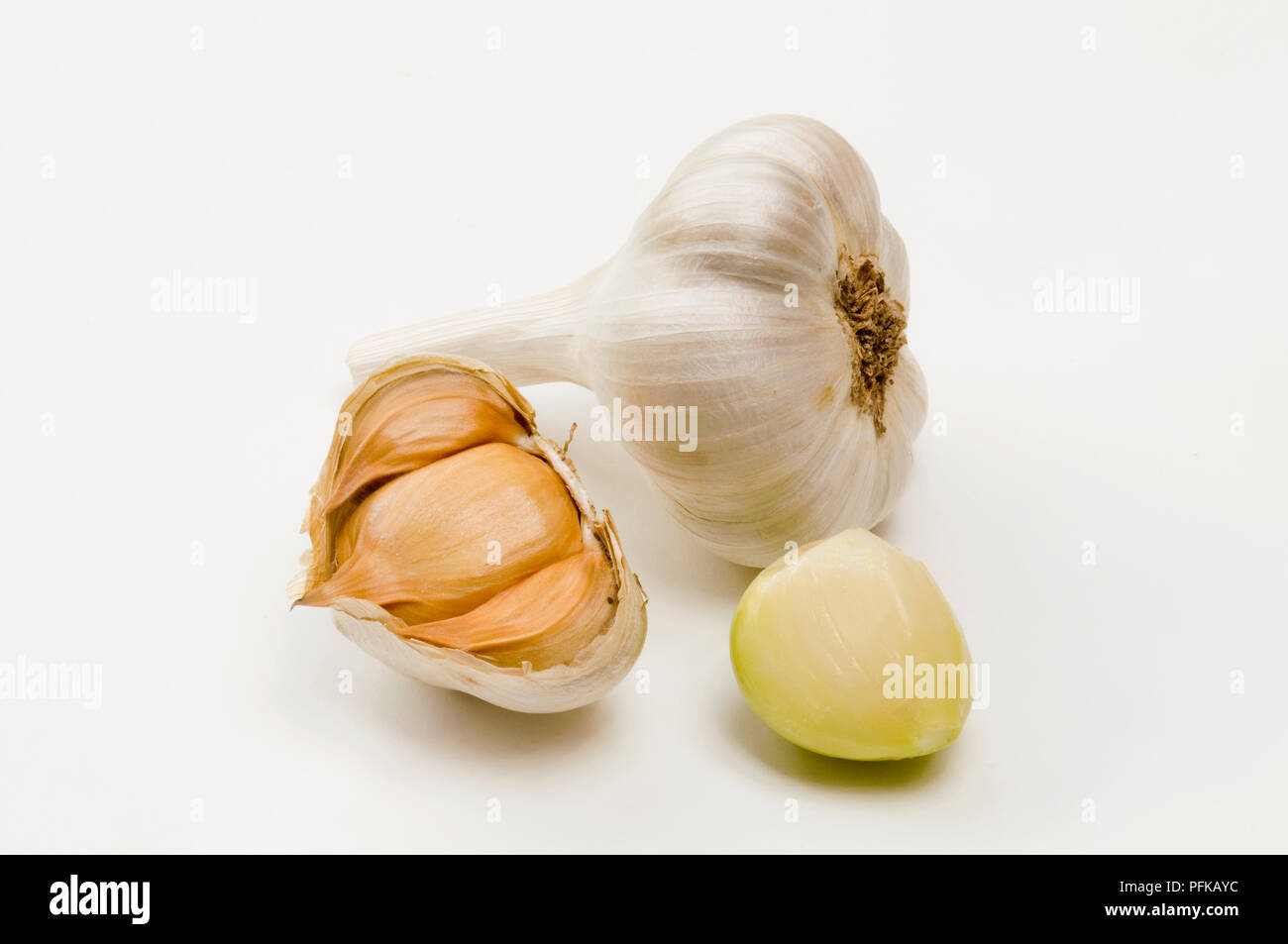 Garlic bulb and garlic cloves, with skin on and skinned Stock Photo Alamy
