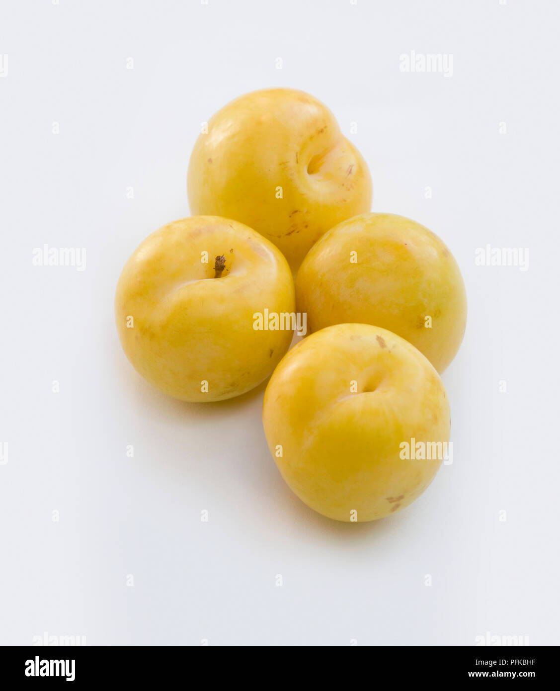 Four yellow plums, closeup Stock Photo Alamy