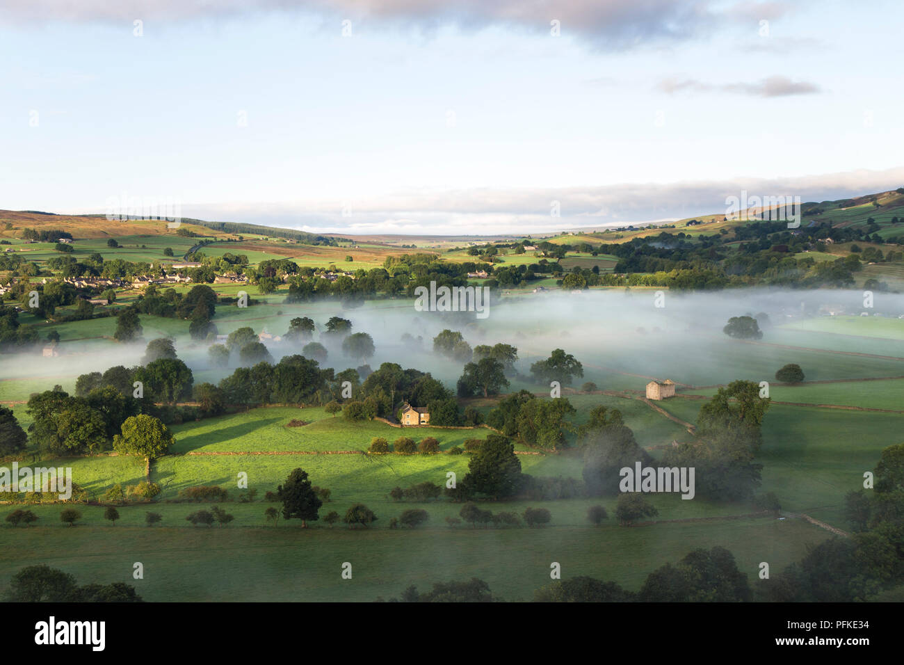 The View Over a Misty Tees Valley Towards the Village of Mickleton and Beyond into Lunedale from Whistle Crag, Middleton-in-Teesdale, County Durham, U Stock Photo