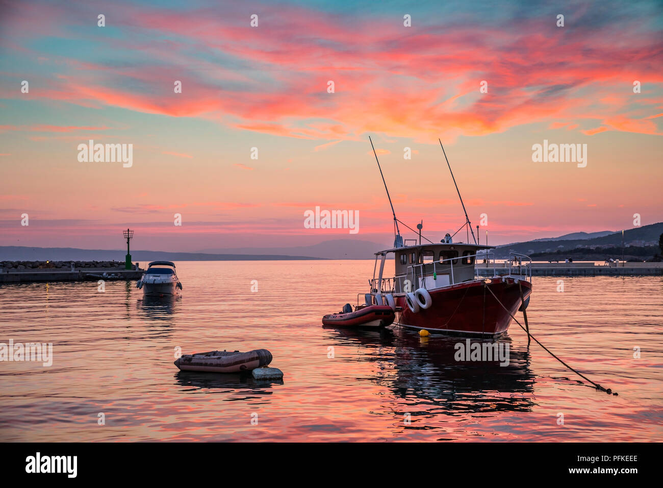 Fishing boat at pinky sunset Stock Photo