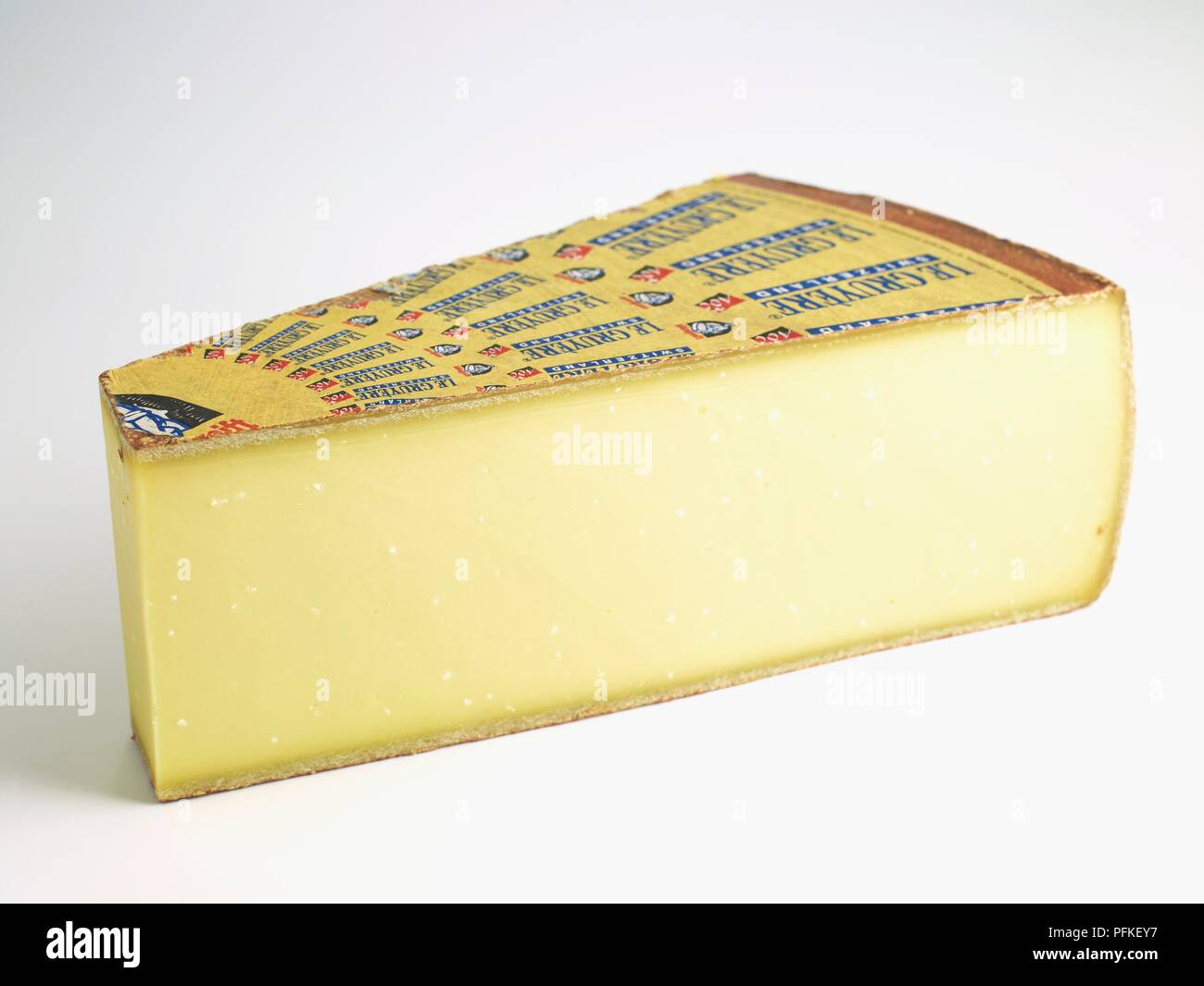 Slice of Swiss Gruyere AOC cow's milk cheese Stock Photo Alamy