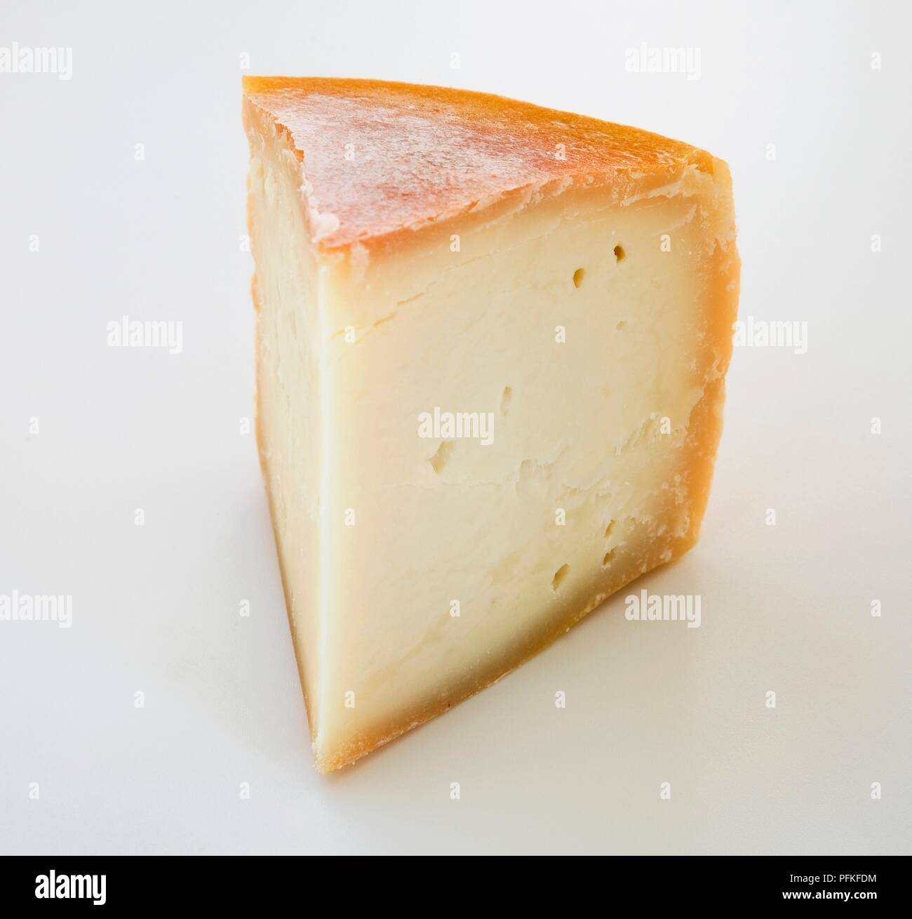 Slice of American Gravenstein Gold goat's cheese Stock Photo