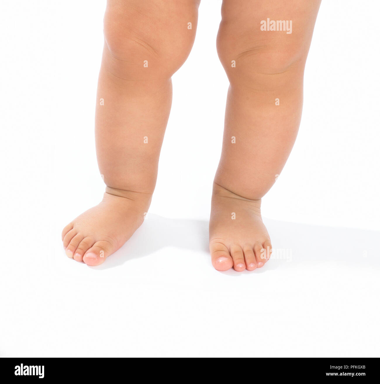 Legs and feet of baby boy Stock Photo
