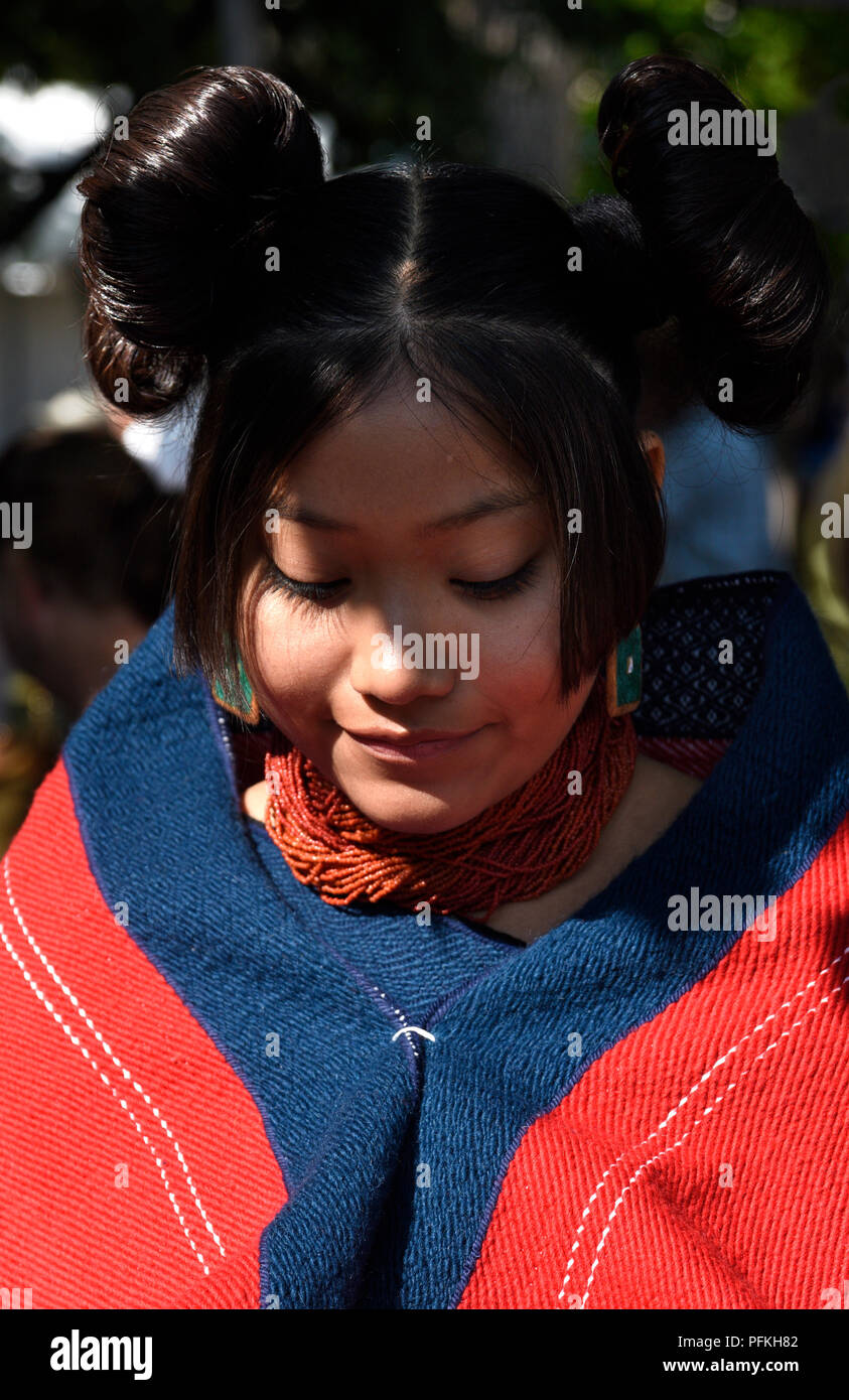 A young Native American (Hopi) woman wearing traditional Hopi clothing and  hairstyle at the Santa Fe Indian Market Stock Photo - Alamy