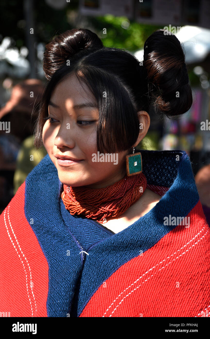 A young Native American (Hopi) woman wearing traditional Hopi clothing and hairstyle at the Santa Fe Indian Market Stock Photo