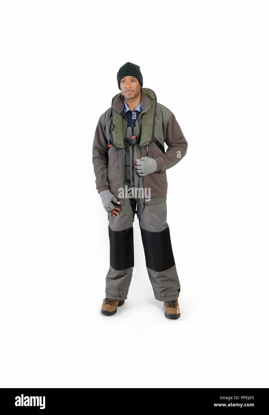 Man dressed for boat-fishing, wearing waterproof clothing and life jacket Stock Photo