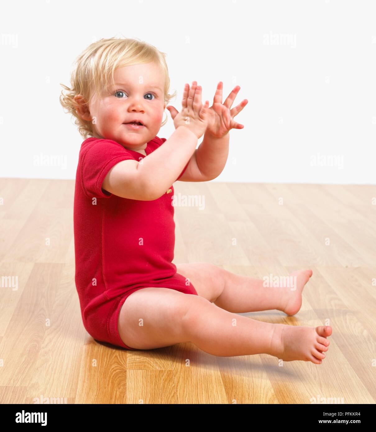 Baby girl clapping hands Stock Photo Alamy