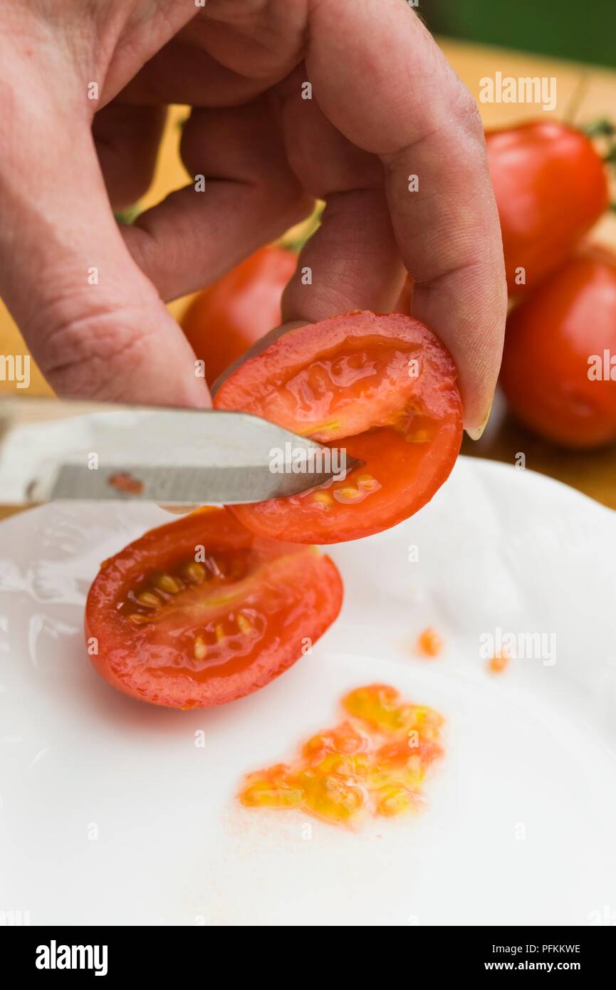 Using Knife To Remove Seeds From Ripe Tomato Stock Photo Alamy Using Knife To Remove Seeds From Ripe Tomato Stock Photo Alamy