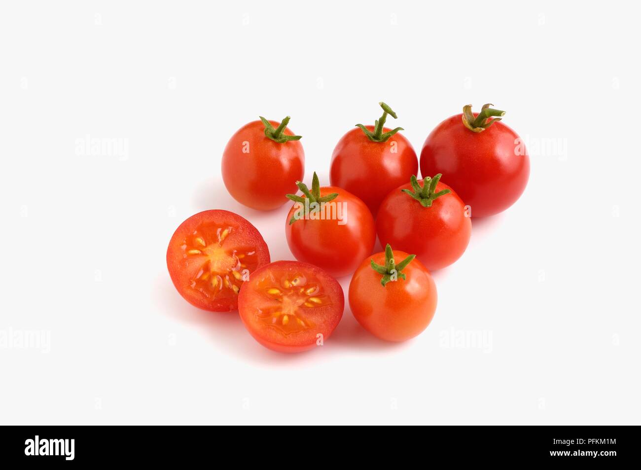 Whole and sliced Tomatoes 'Tiny Tim' Stock Photo