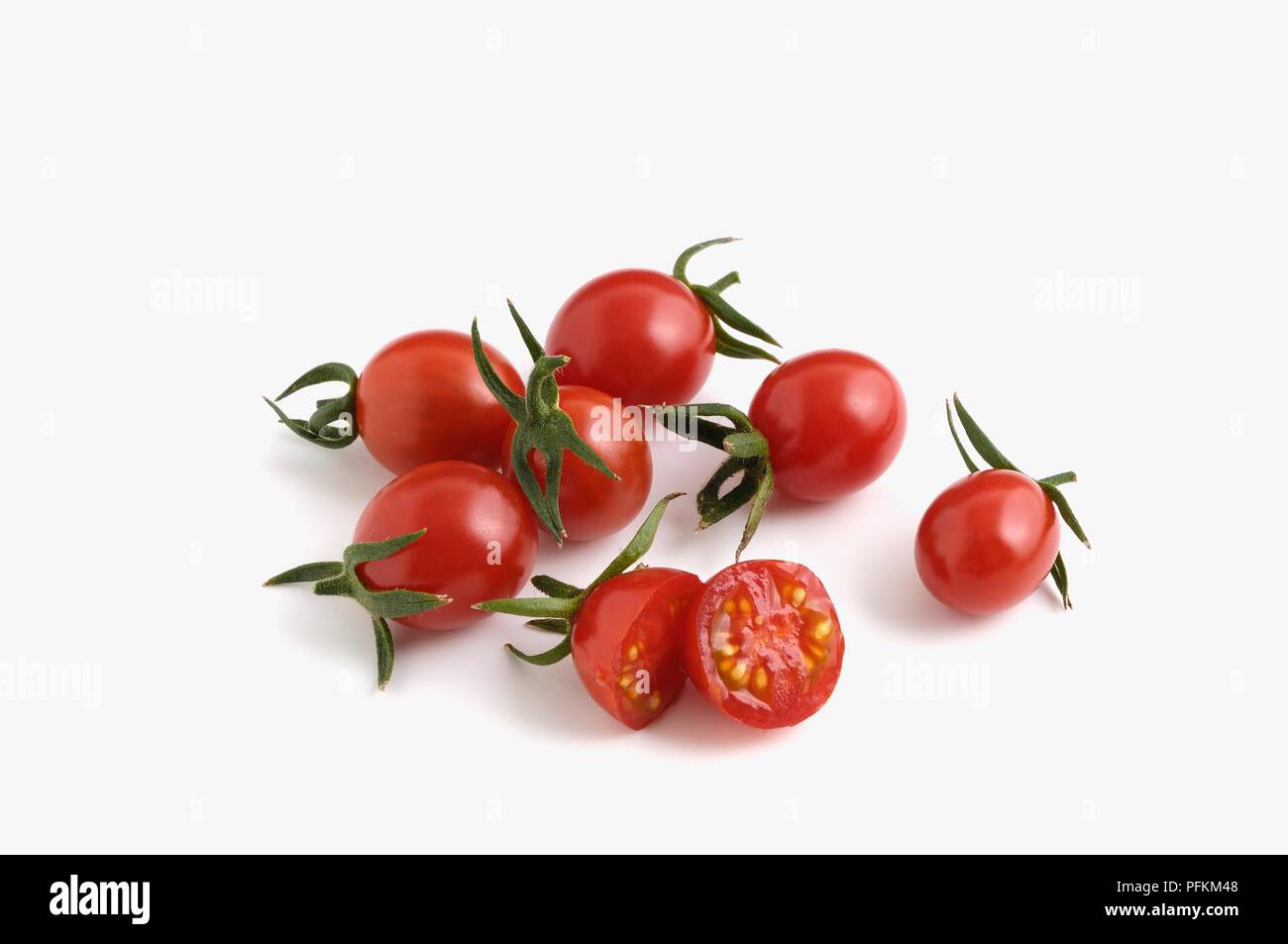 Whole and sliced Taiwanese Ruby red tomatoes Stock Photo Alamy
