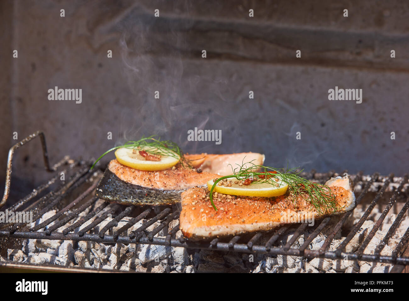 salmon on grill with dill lemon Stock Photo Alamy