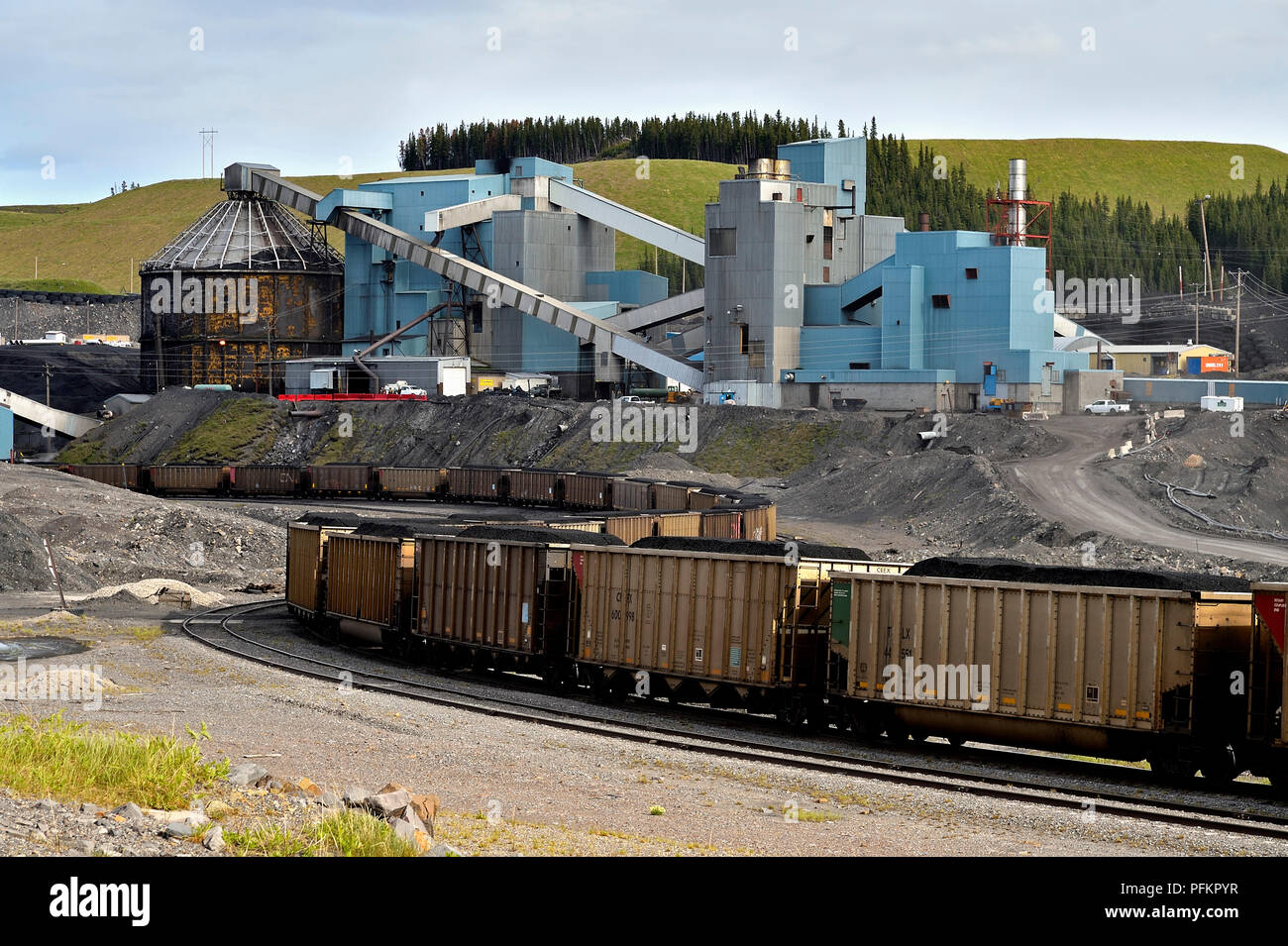 The coal processing plant near Cadomin Alberta with loaded rail cars in front Stock Photo
