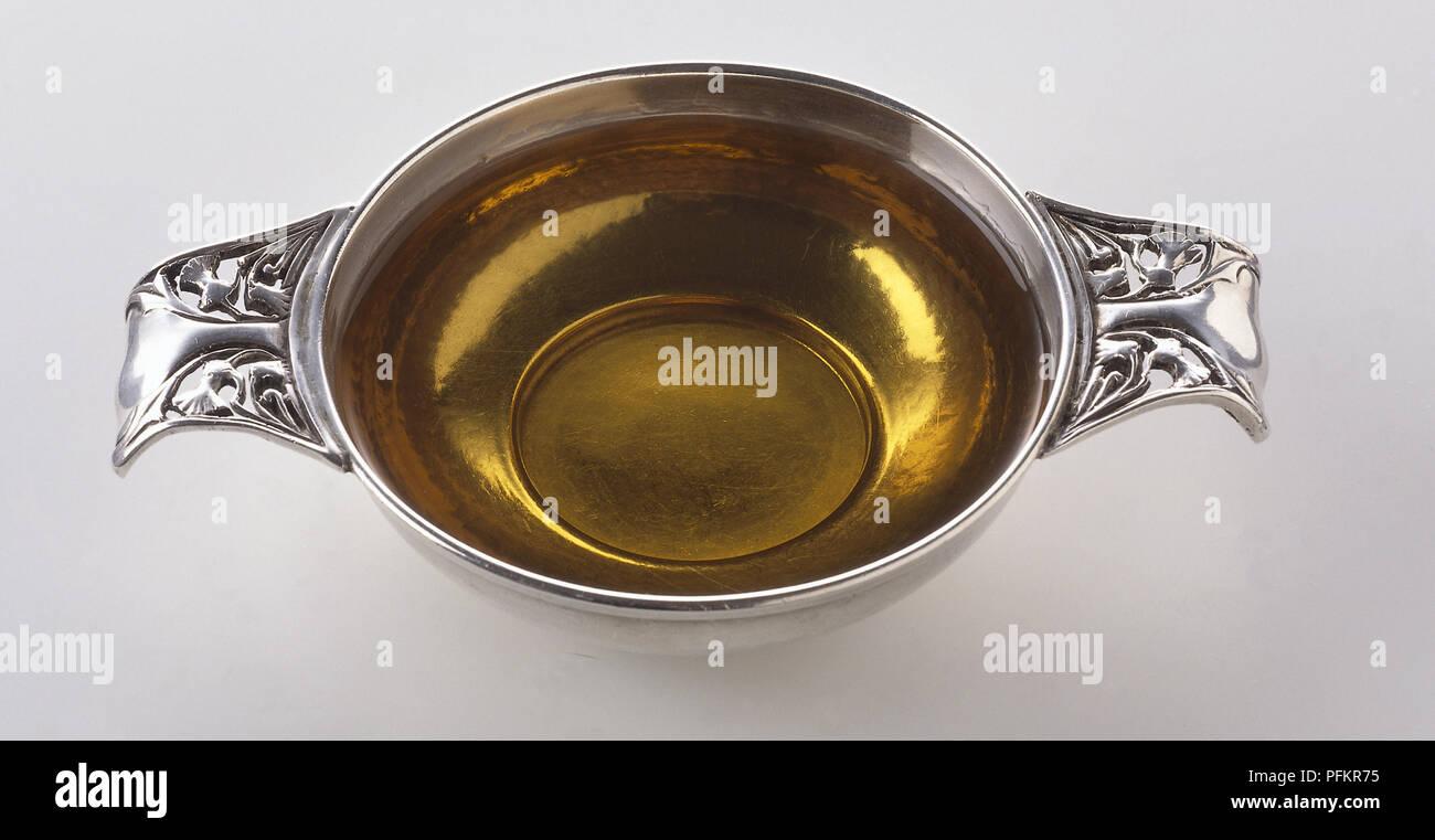 Scottish whisky in a traditional silver drinking vessel, or 'Quaichs