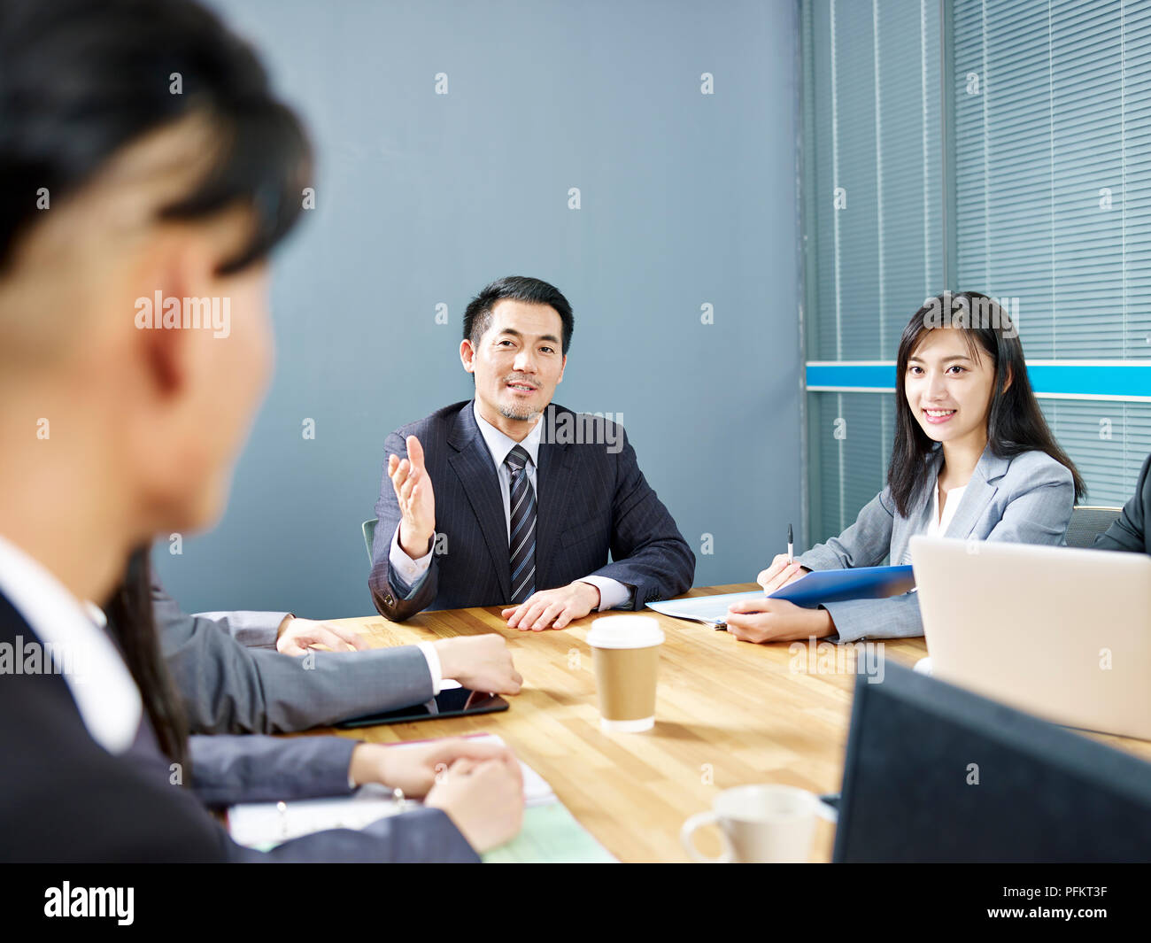 asian corporate business people talking during discussion meeting in office. Stock Photo