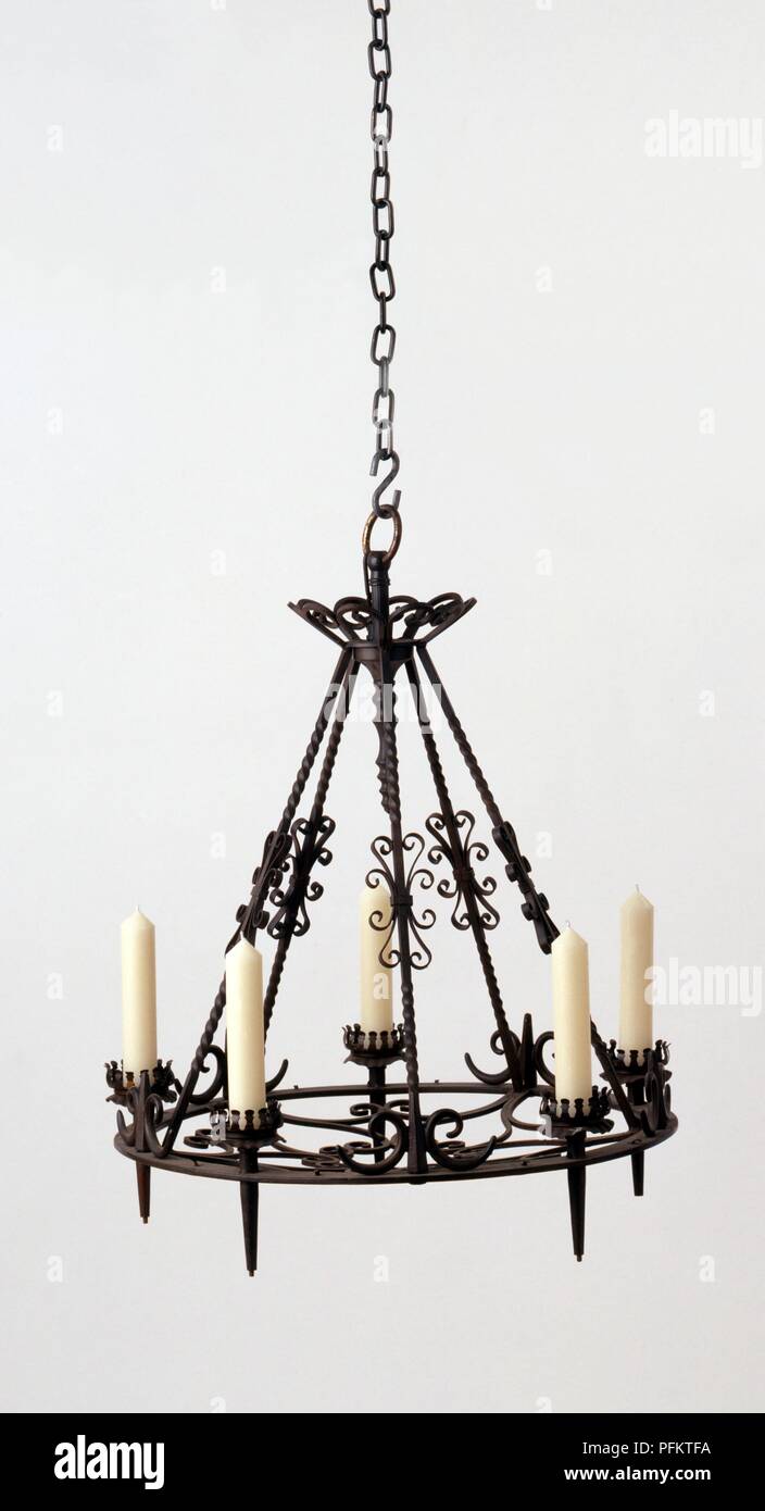 Ornate wrought iron chandelier hanging from chain Stock Photo Alamy