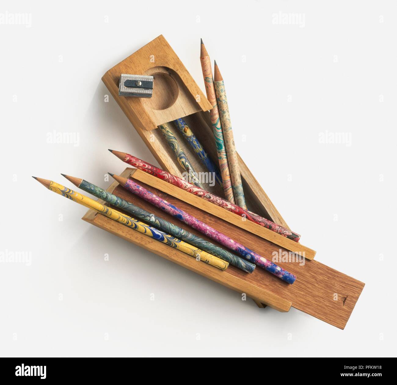 Old fashioned wood pencil case, pencils, and pencil sharpener Stock Photo